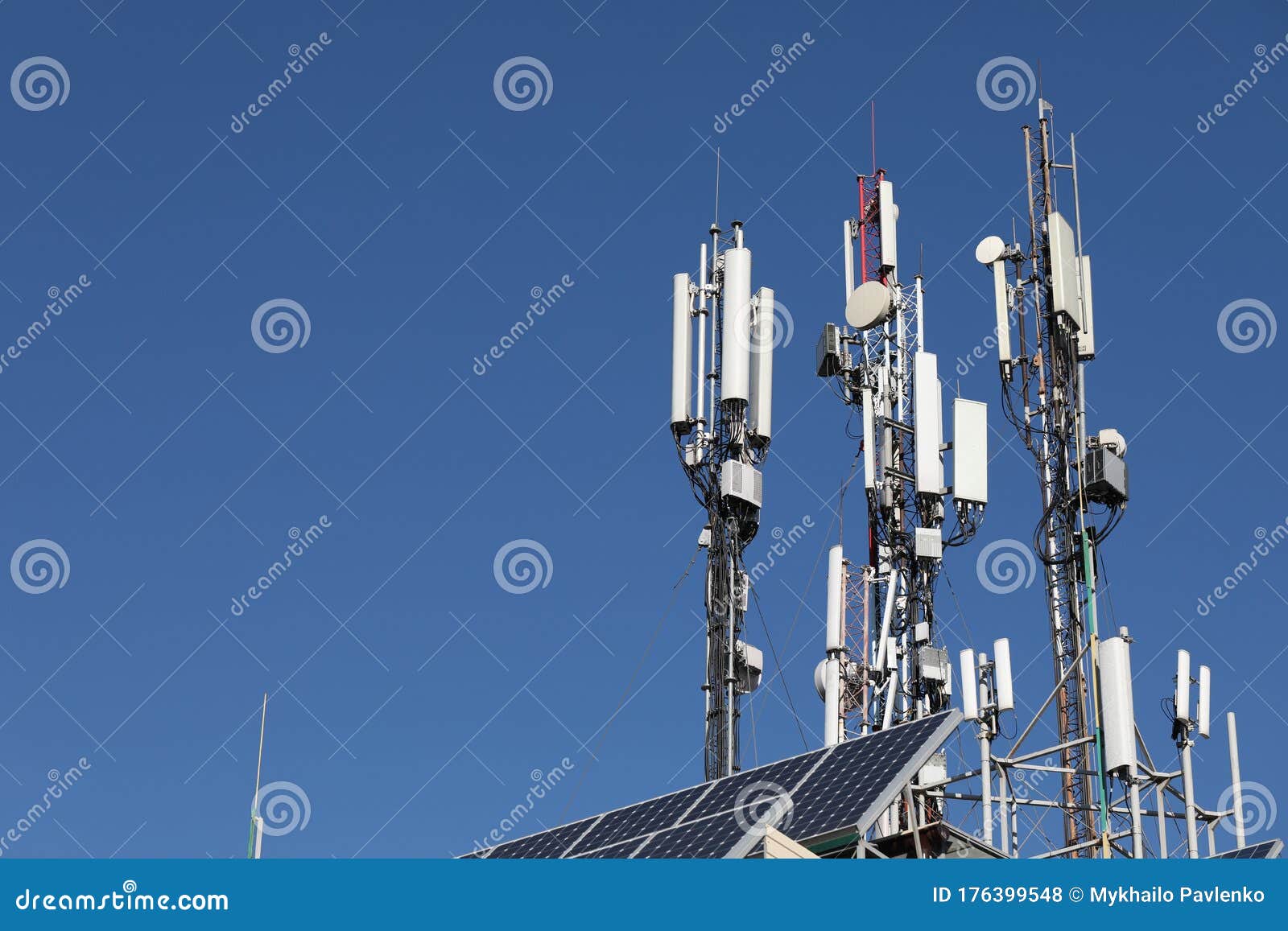 Mobile Towers on Blue Sky Background. Many Communication Equipment
