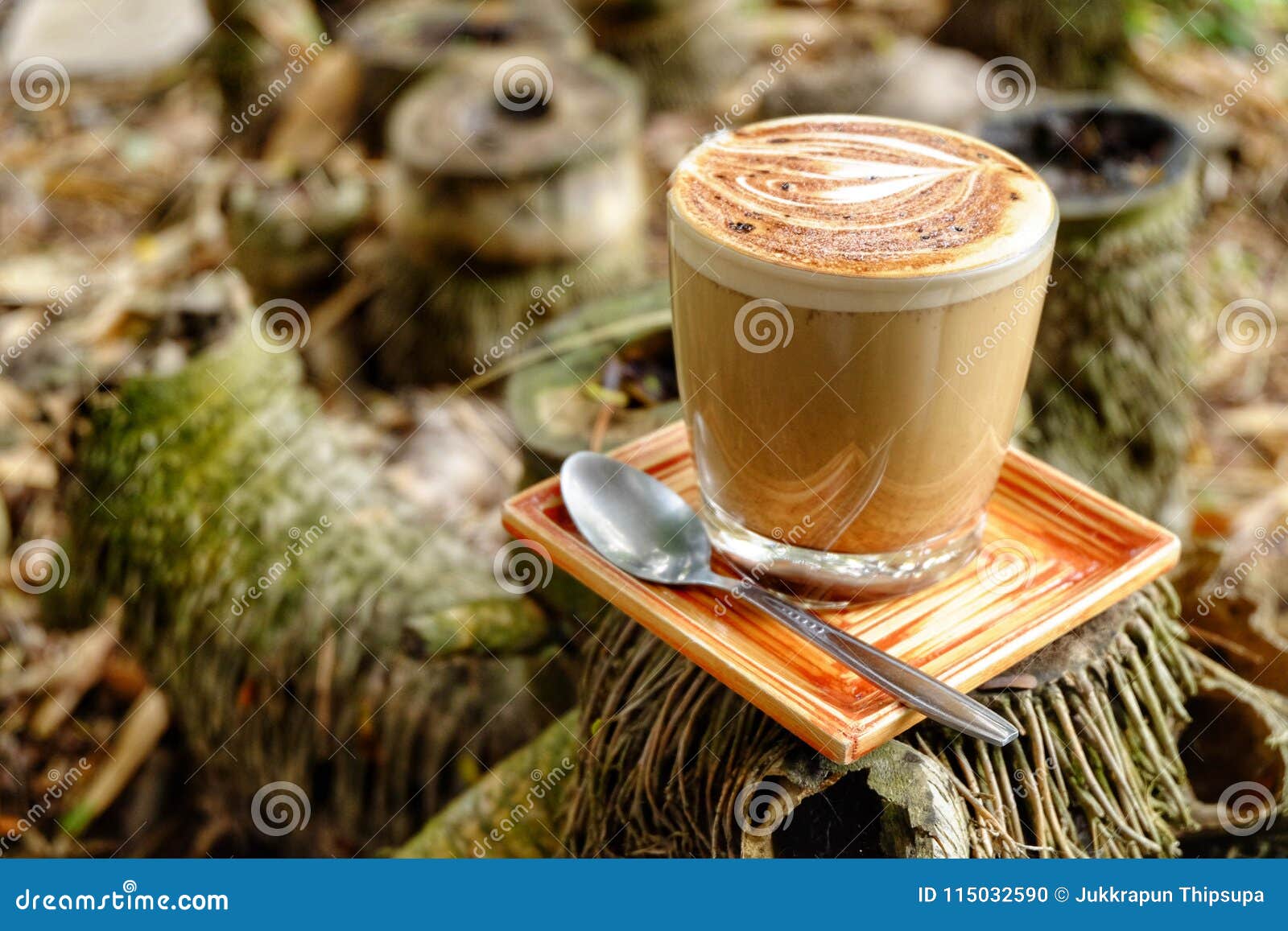 Mocha Coffee Mug.Mocha Coffee Cup Put On Bamboo Stump. Stock Photo
