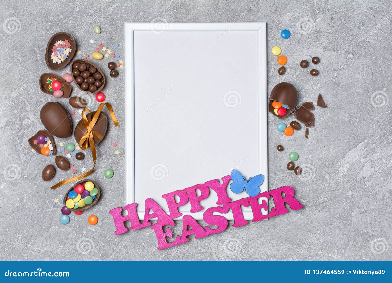 Mock Up Of Blank White Frame With Pink Text Of Happy Easter And Traditional Sweets As Chocolate ...