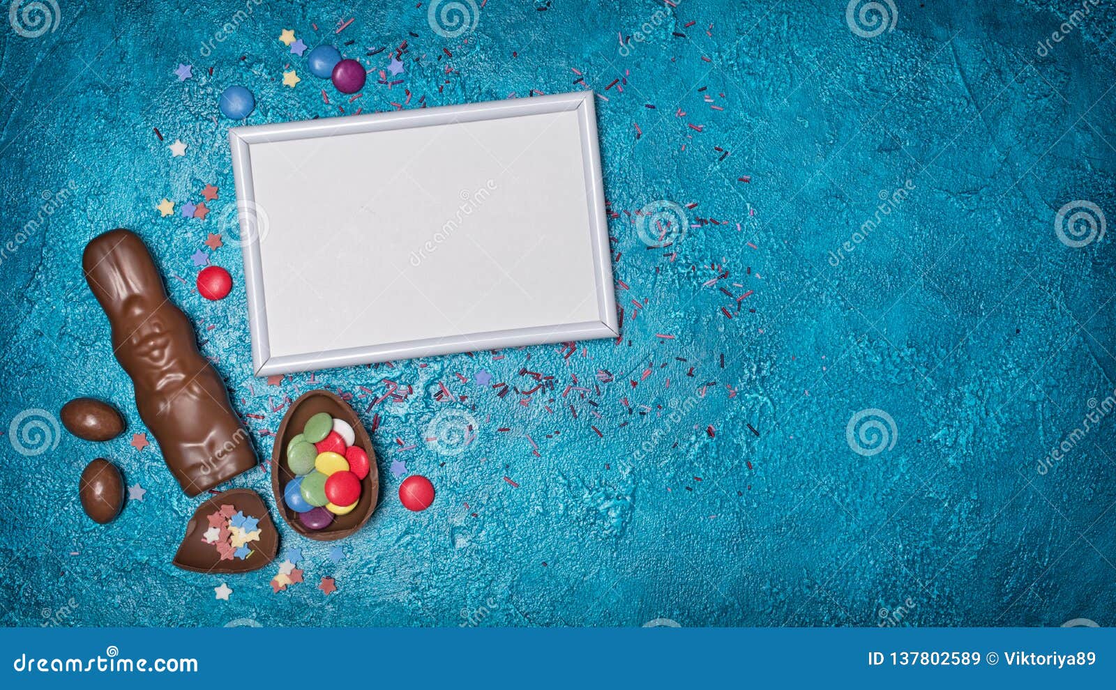 Download Mock Up Of Blank White Frame With Traditional Easter Sweets As Chocolate Bunny And Eggs Stock ...