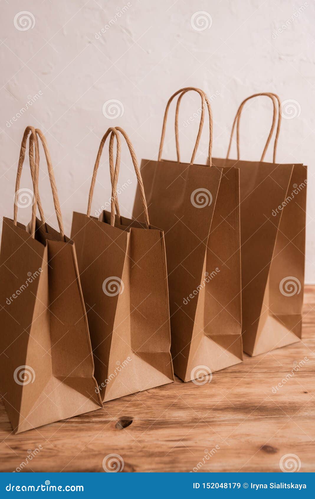 Download Mock-up Of Brown Craft Paper Package With Handles, Empty Shopping Bag With Area For Your Logo Or ...