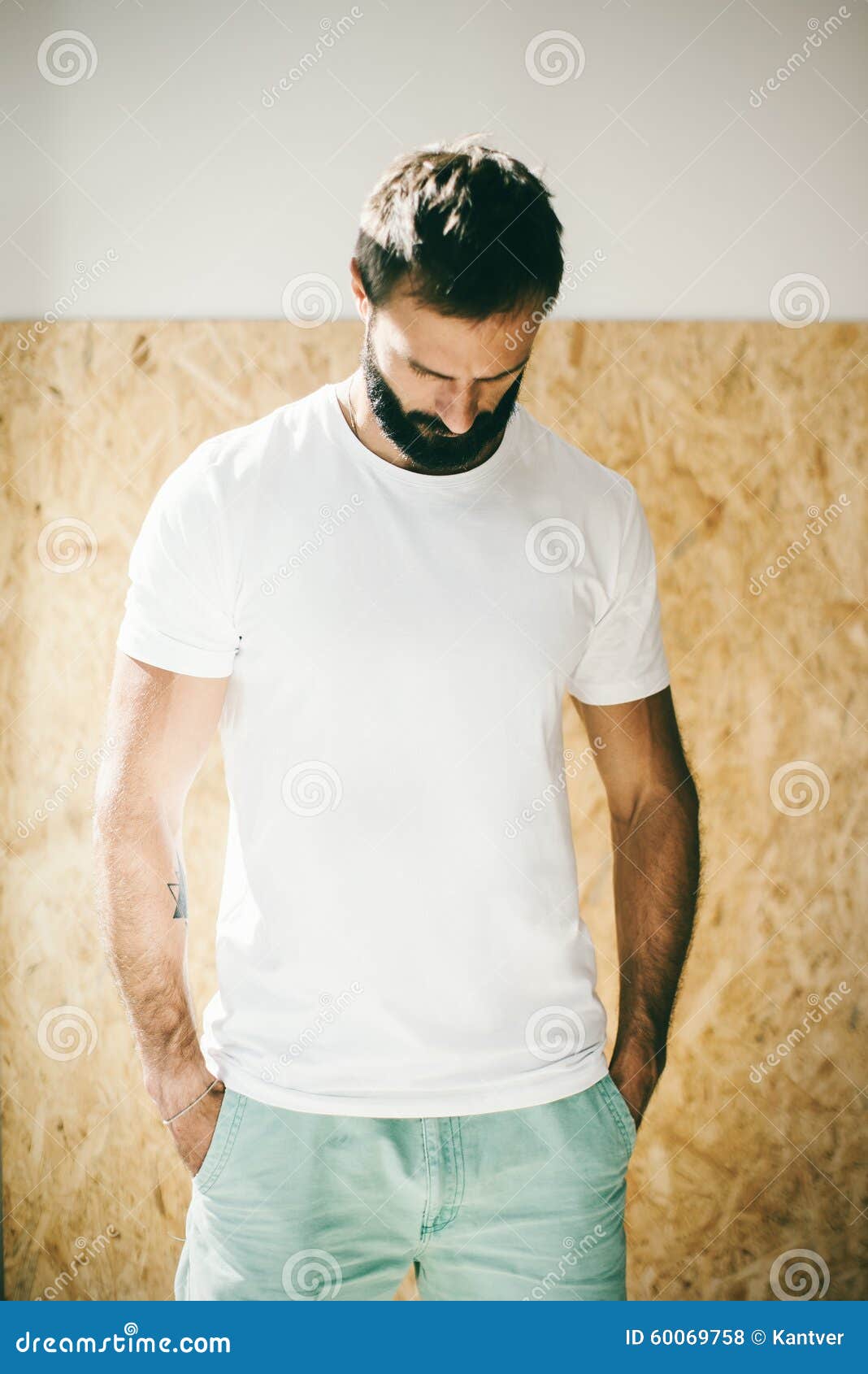 Download Mockup Of A Bearded Man Wearing White Tshirt And Stock ...