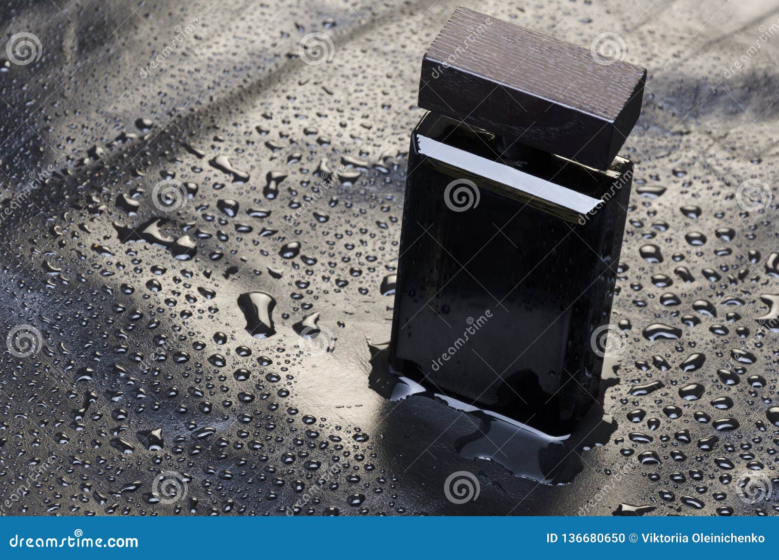 Download Mockup Of Black Bottle Of Perfume On Piece Of Leather.Sunset Yellow, Orange Tones Stock Photo ...