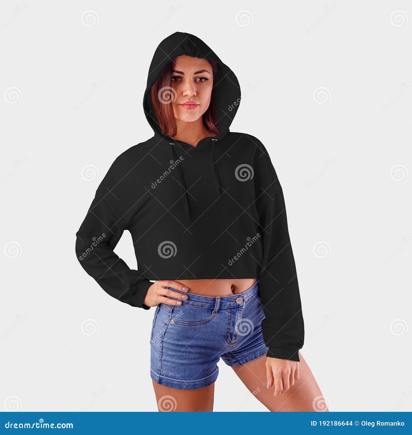 Mockup of a Black Hoodie on a Girl in Blue Shorts, Posing on a White ...