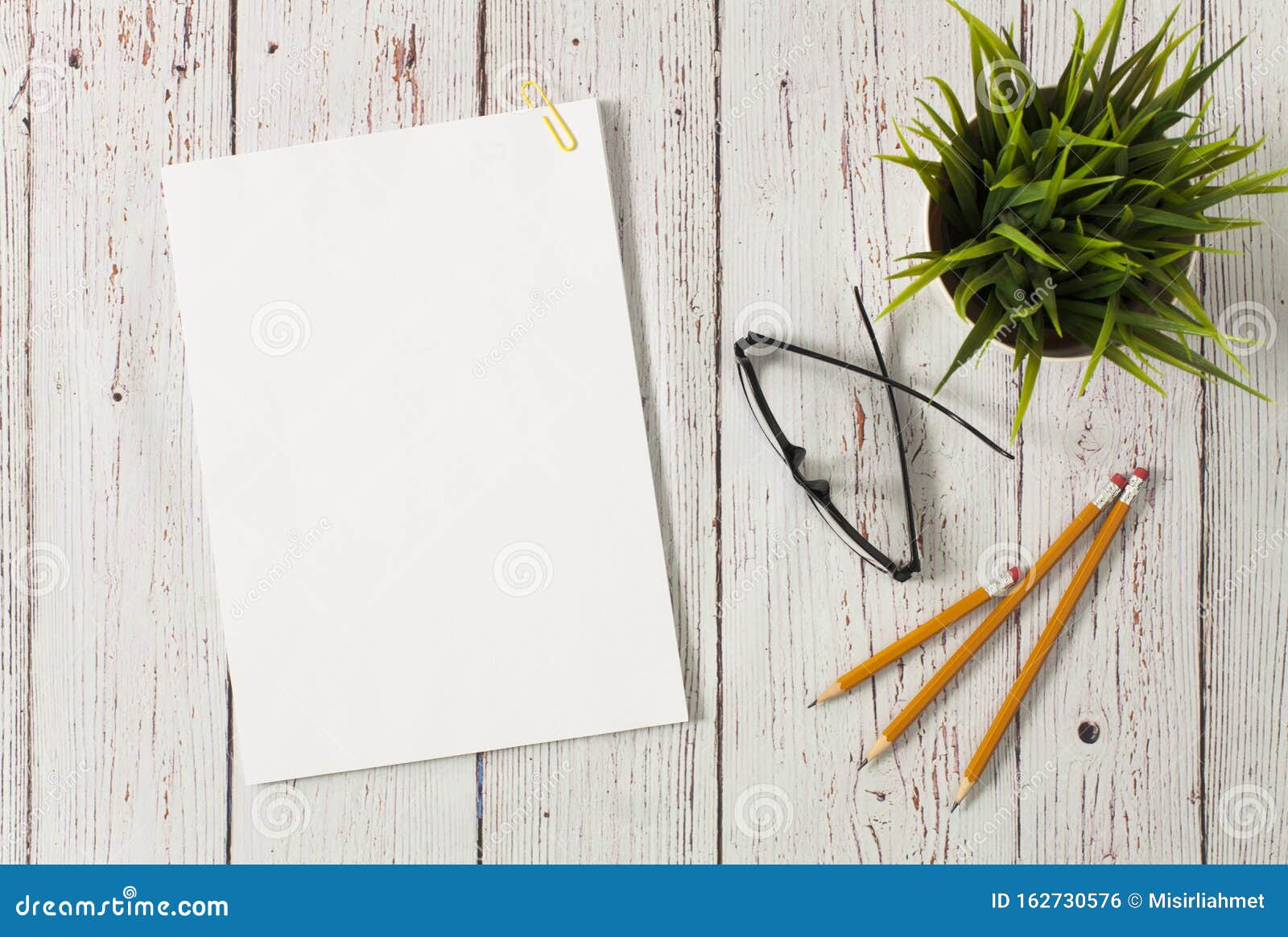 Download Mockup With Blank Paper Stack On White Table Stock Photo ...
