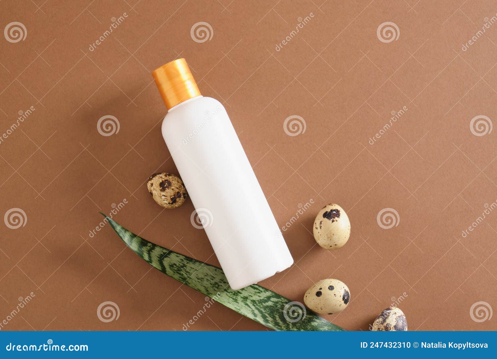 mockup bottle and quail eggs on brown background