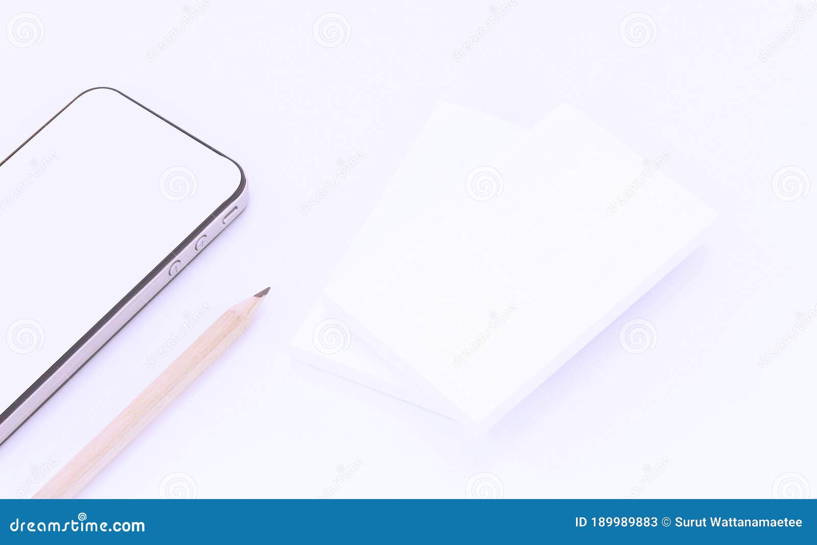 mockup of business cards with smart phone on white textured paper background