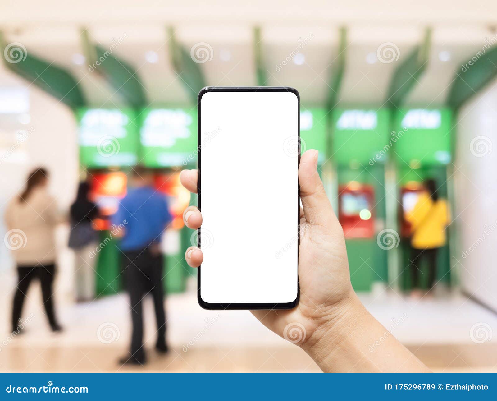 mockup cellphone, hand using smart phone with empty blank screen with blurred image of people using atm automated teller machine