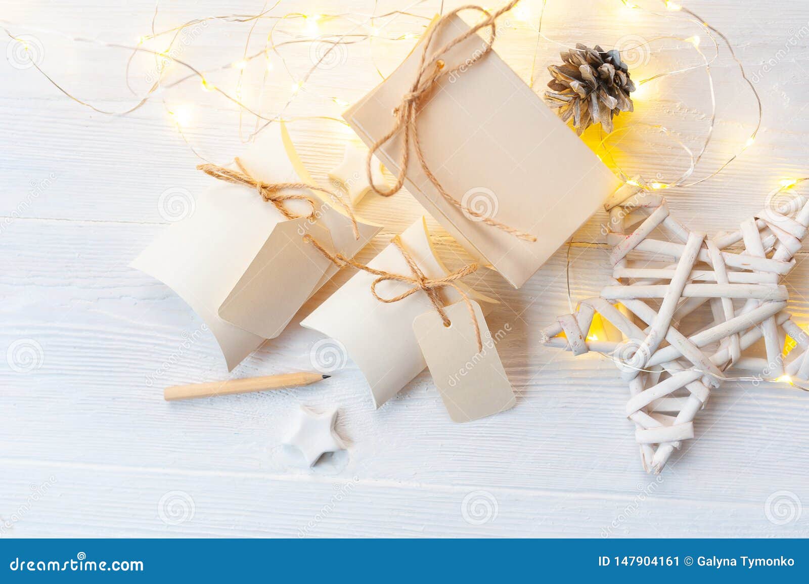 Download Mockup Christmas Kraft Gift Boxes With Tag On Wooden Background. Top View For Greeting Card ...