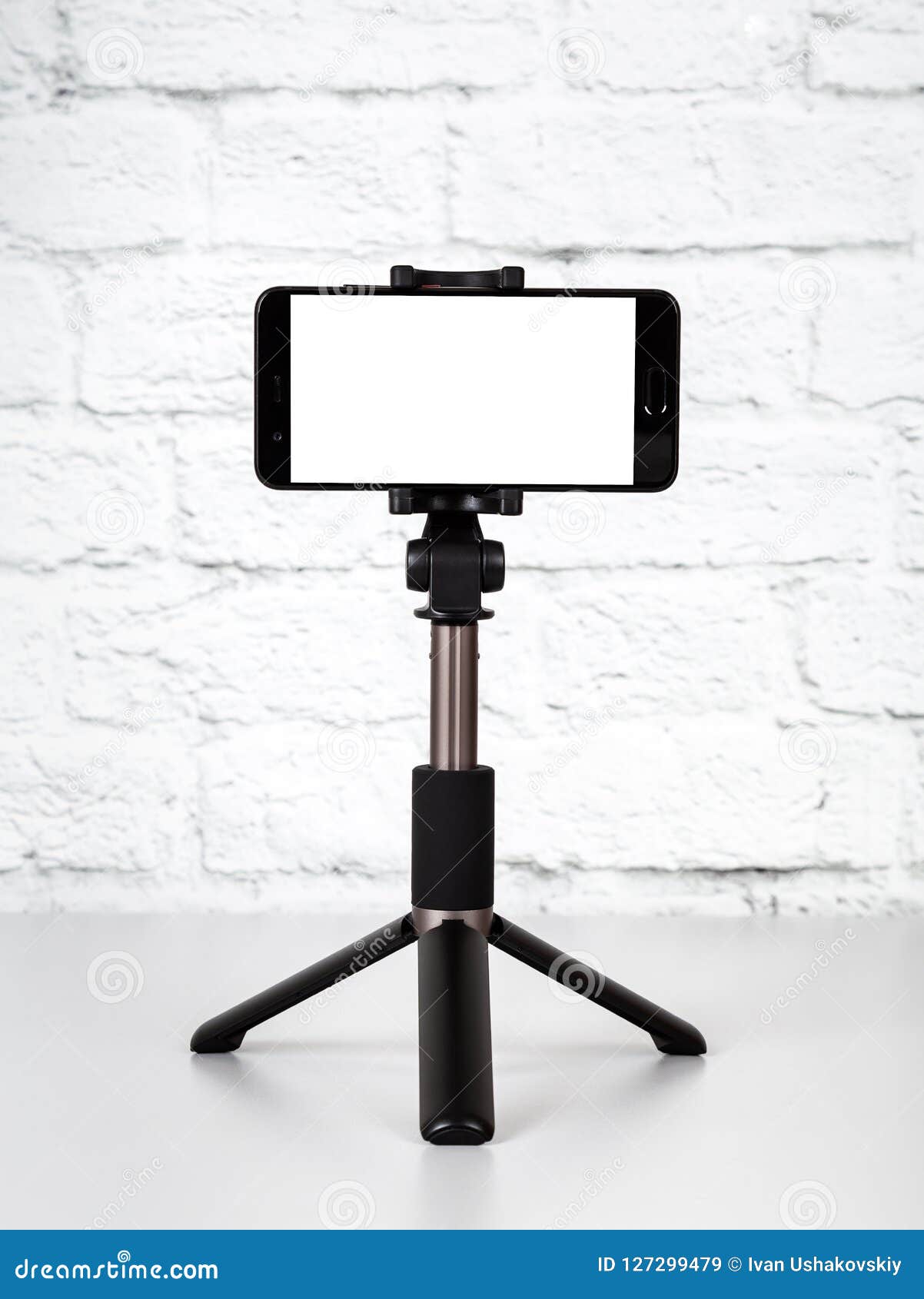 mockup with smartphone on a tripod with empty screen