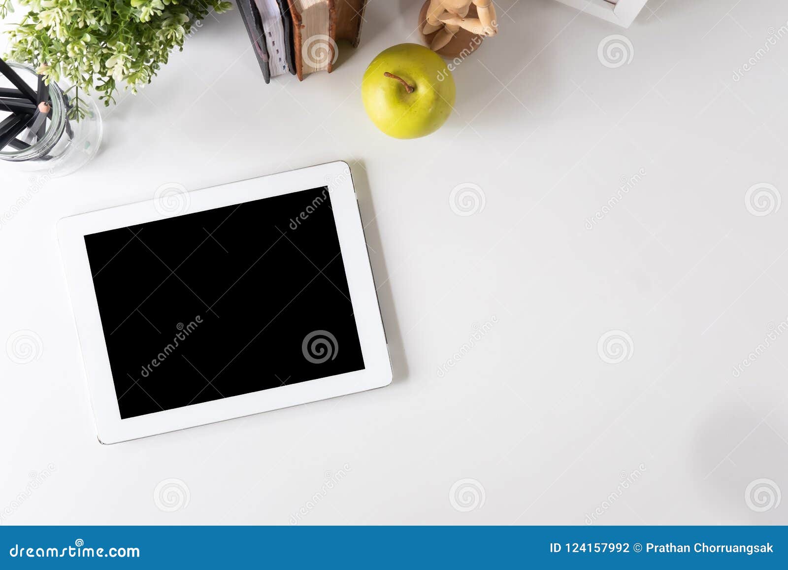 mockup tablet digital on workspace with top view table.