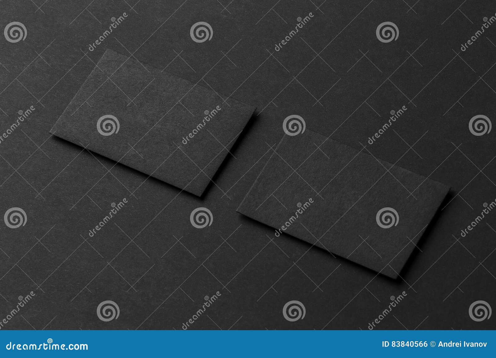 Mockup of Two Blank Business Cards at Black Textured Background. Stock