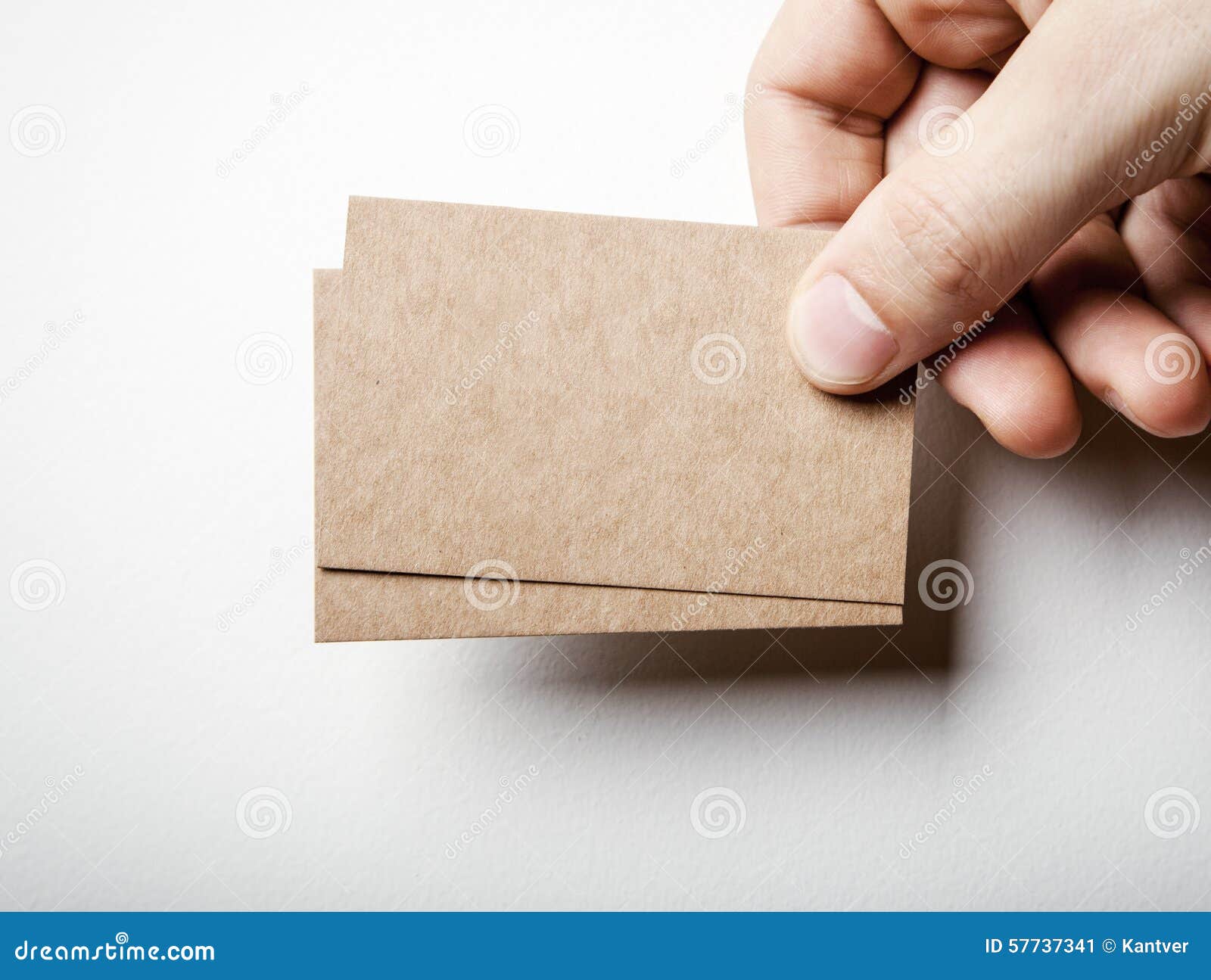 Mockup Two Craft Business Cards And Mans Hand Stock