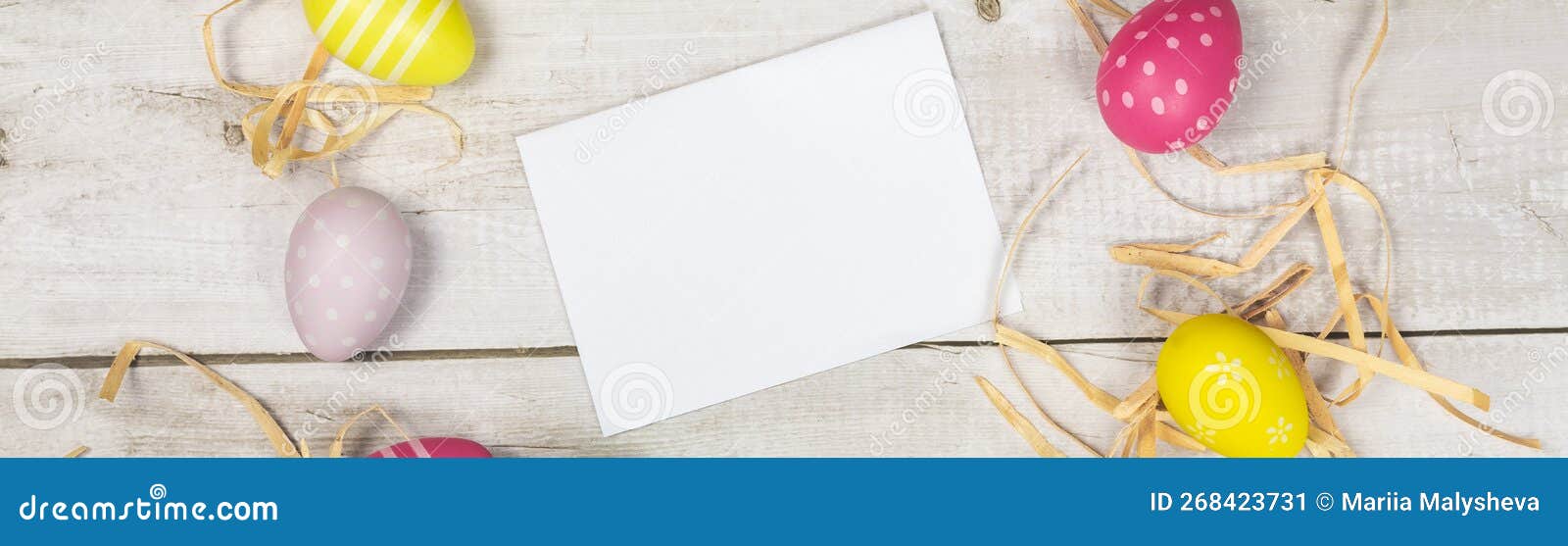 mockup white greeting card, easter eggs and envelope on a white wooden background. banner