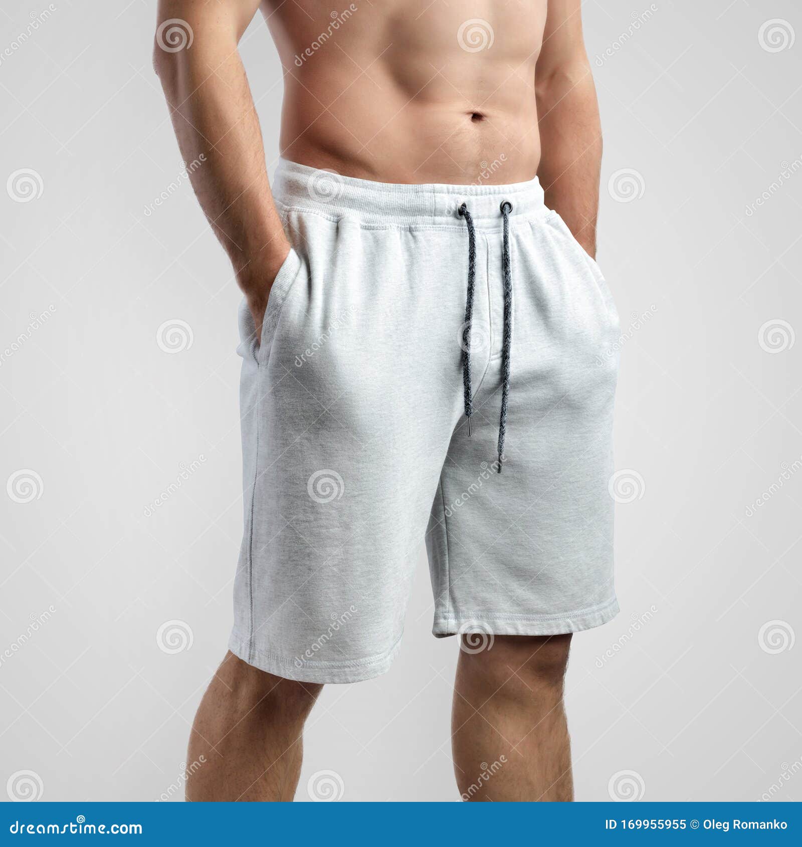 Download Mockup Of White Men`s Shorts On An Isolated Background ...