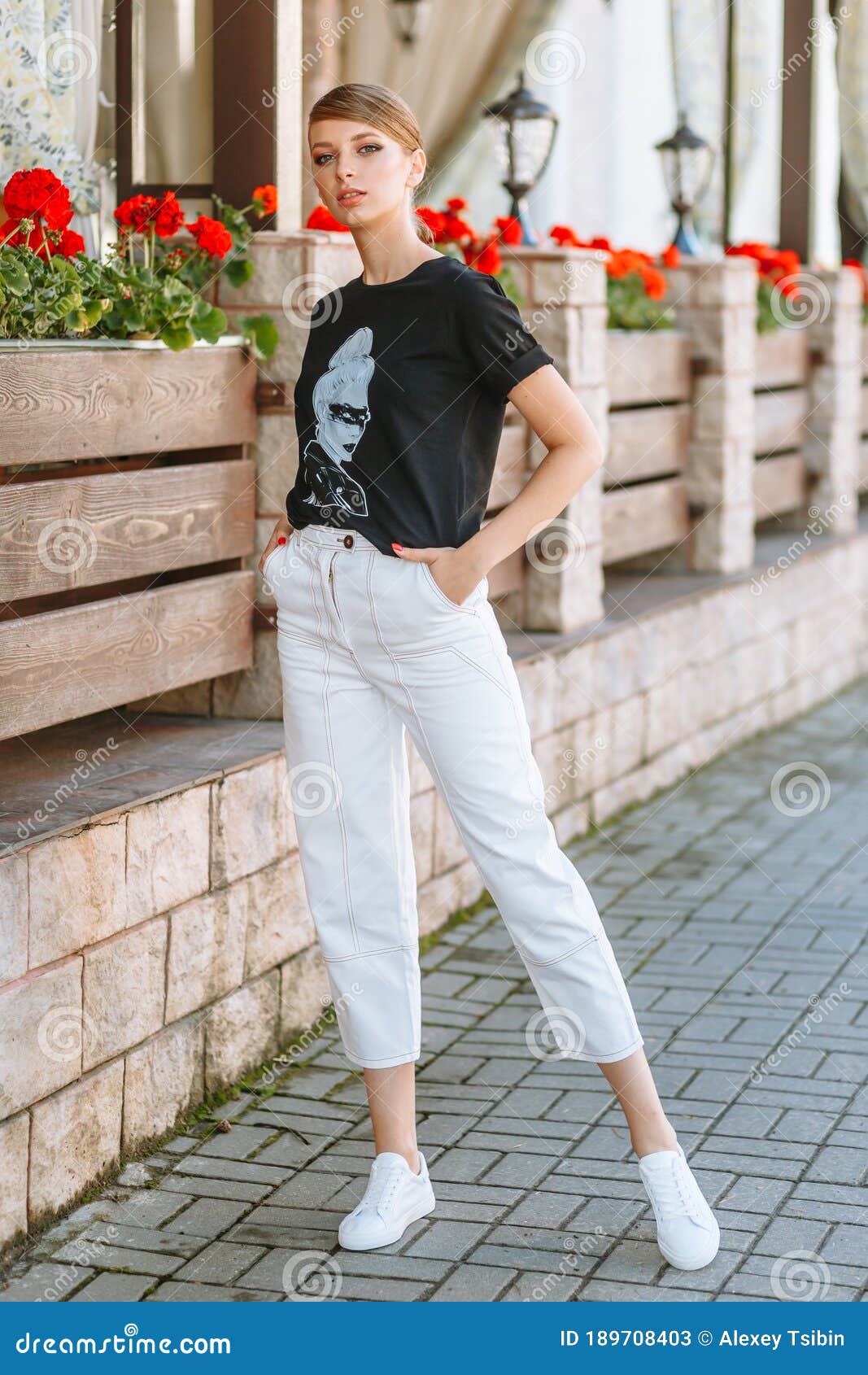 A Model Girl in a Black T Shirt Stands on a Summer Street Stock Image ...