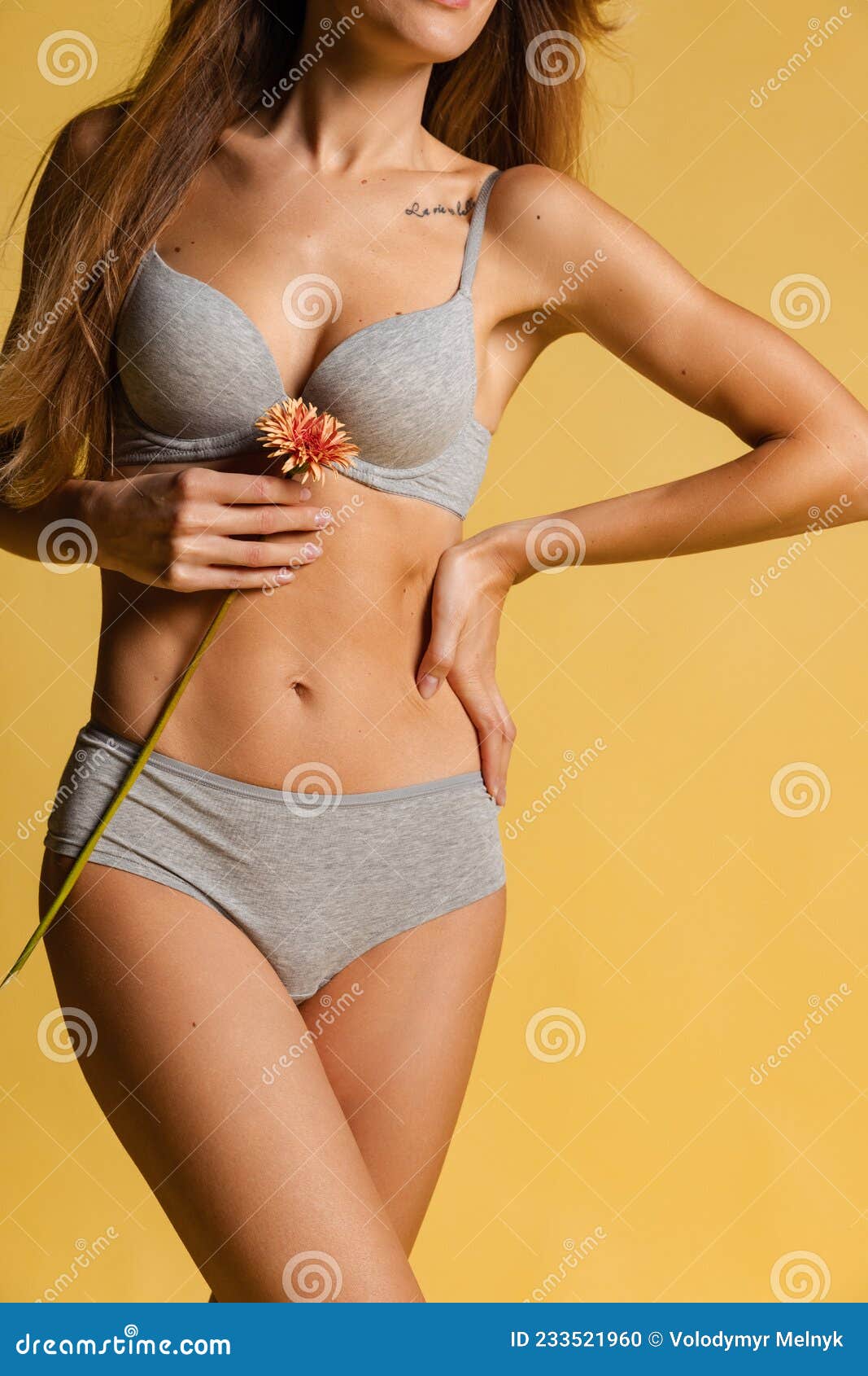 Happy Young Adorable Slim Woman in Underwear Isolated Over Gray