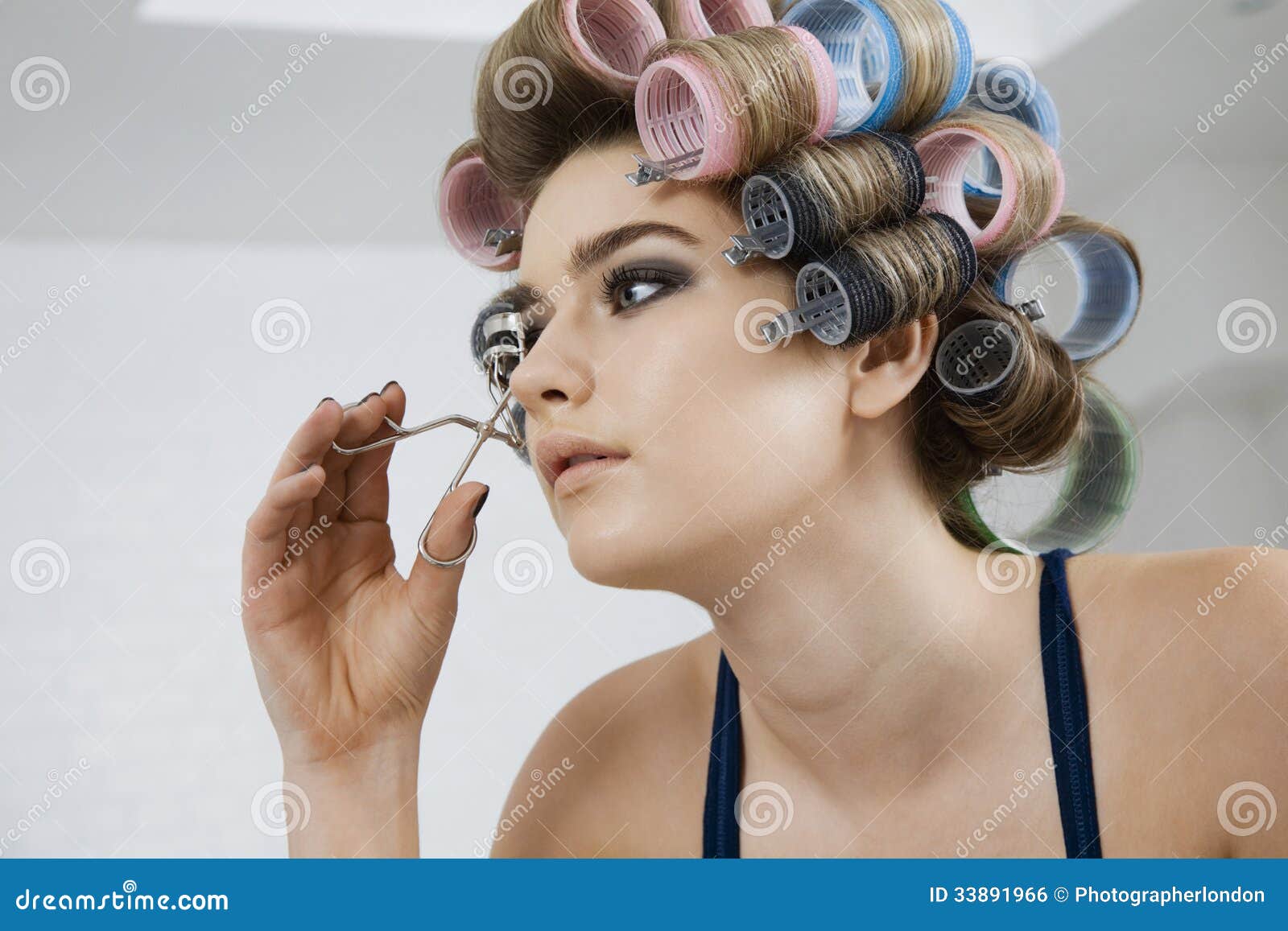 Model in Hair Curlers Using Eyelash Curler Stock Photo - Image of haircare, hairdo: 33891966 Model in Hair Curlers Using Eyelash Curler Stock Photo - Image of haircare, hairdo: 33891966