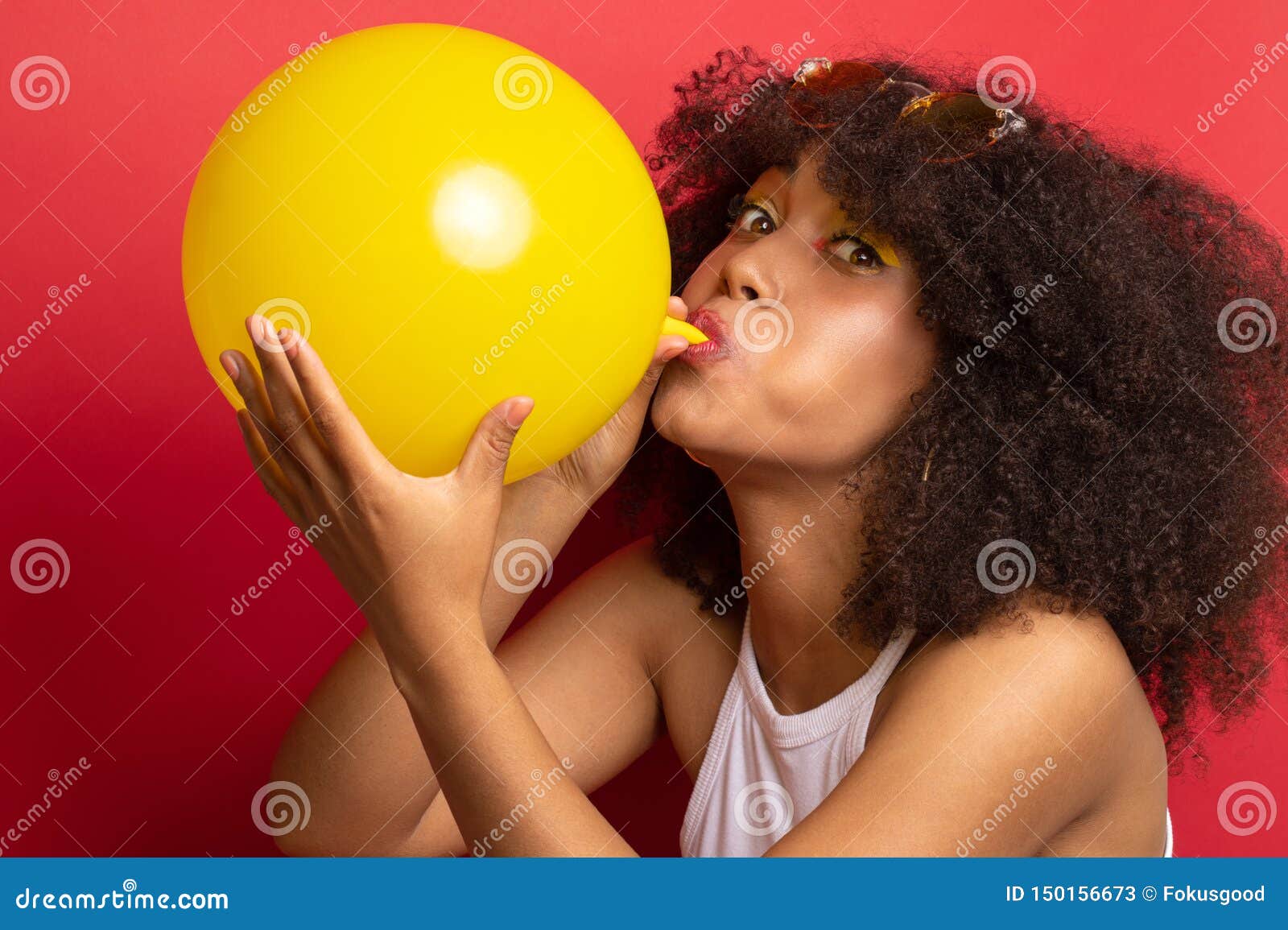 Model with a Lush Hairstyle Inflates a Balloon Stock Image - Image of  enjoyment, background: 150156673