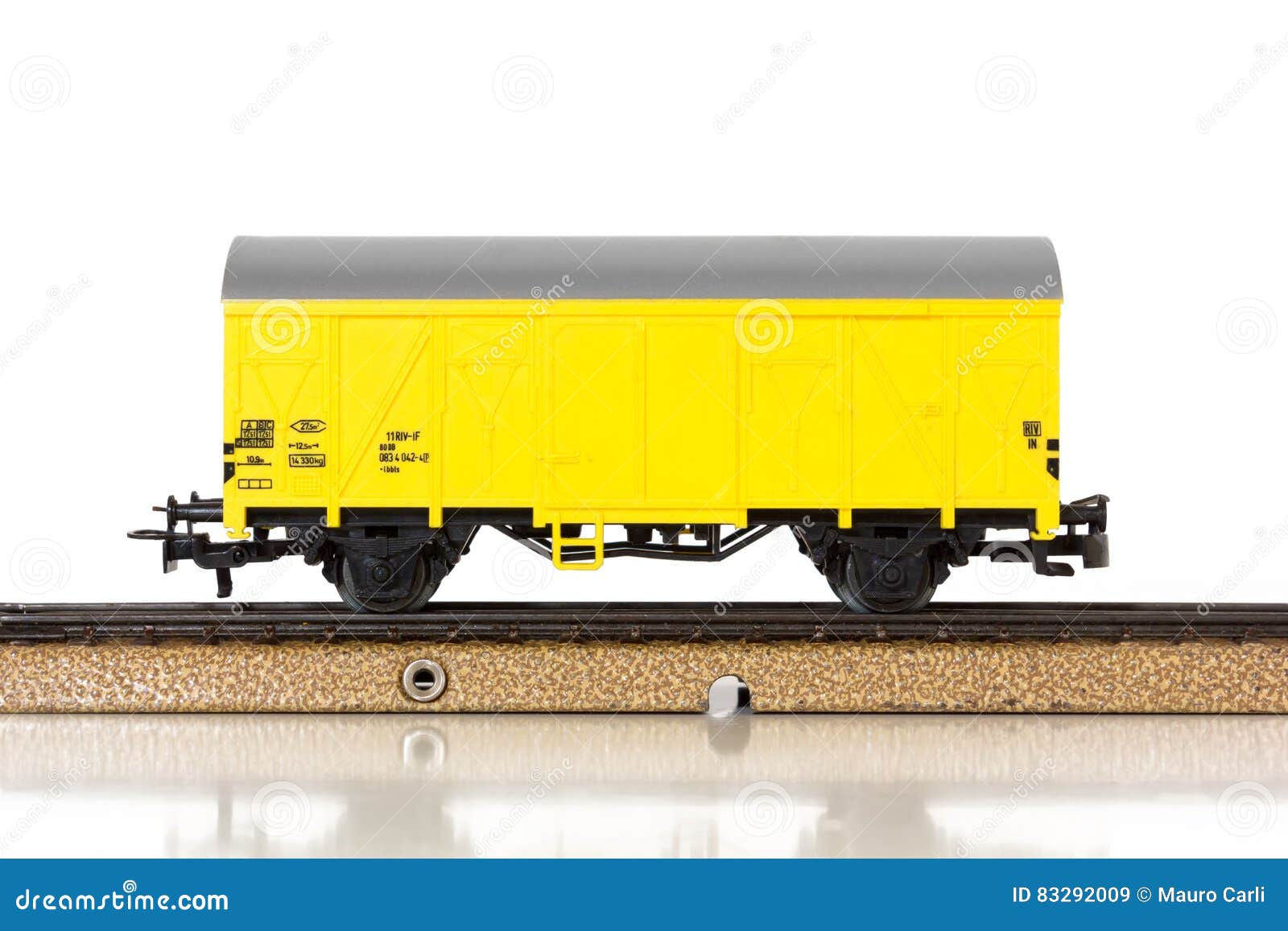 model train`s boxcar on the rails