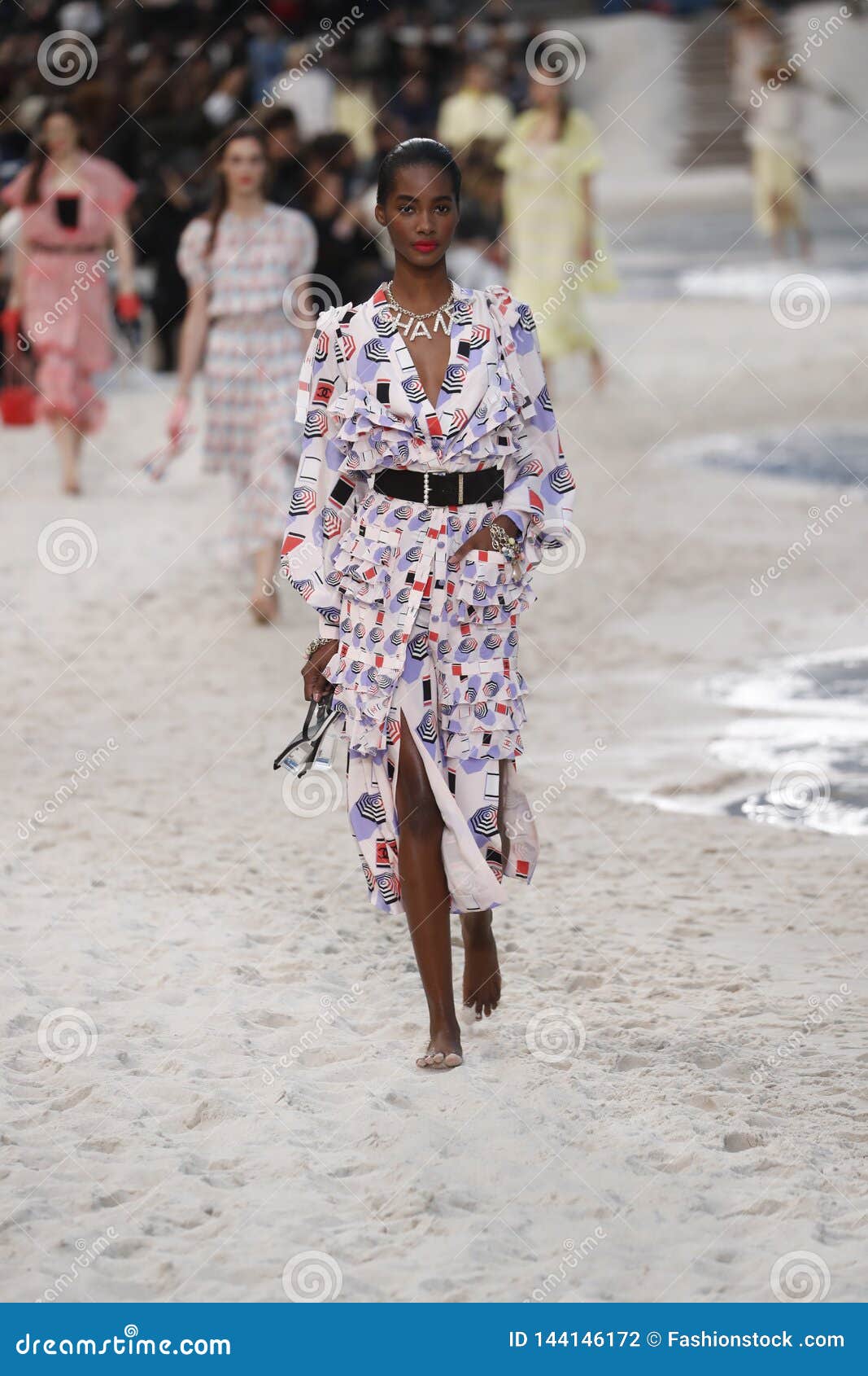 A model walks the runway during the Chanel Haute Couture show as part