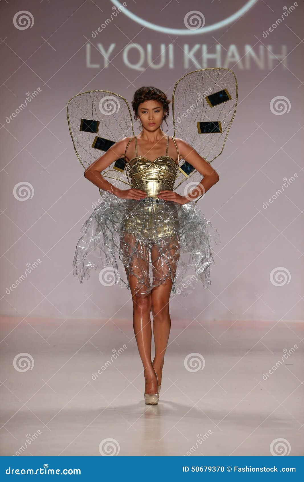 NEW YORK, NY - FEBRUARY 19: A model walks the runway in a design by Ly Qui Khanh at the New York Life fashion show during MBFW Fall 2015 at Lincoln Center on February 19, 2015 in NYC.