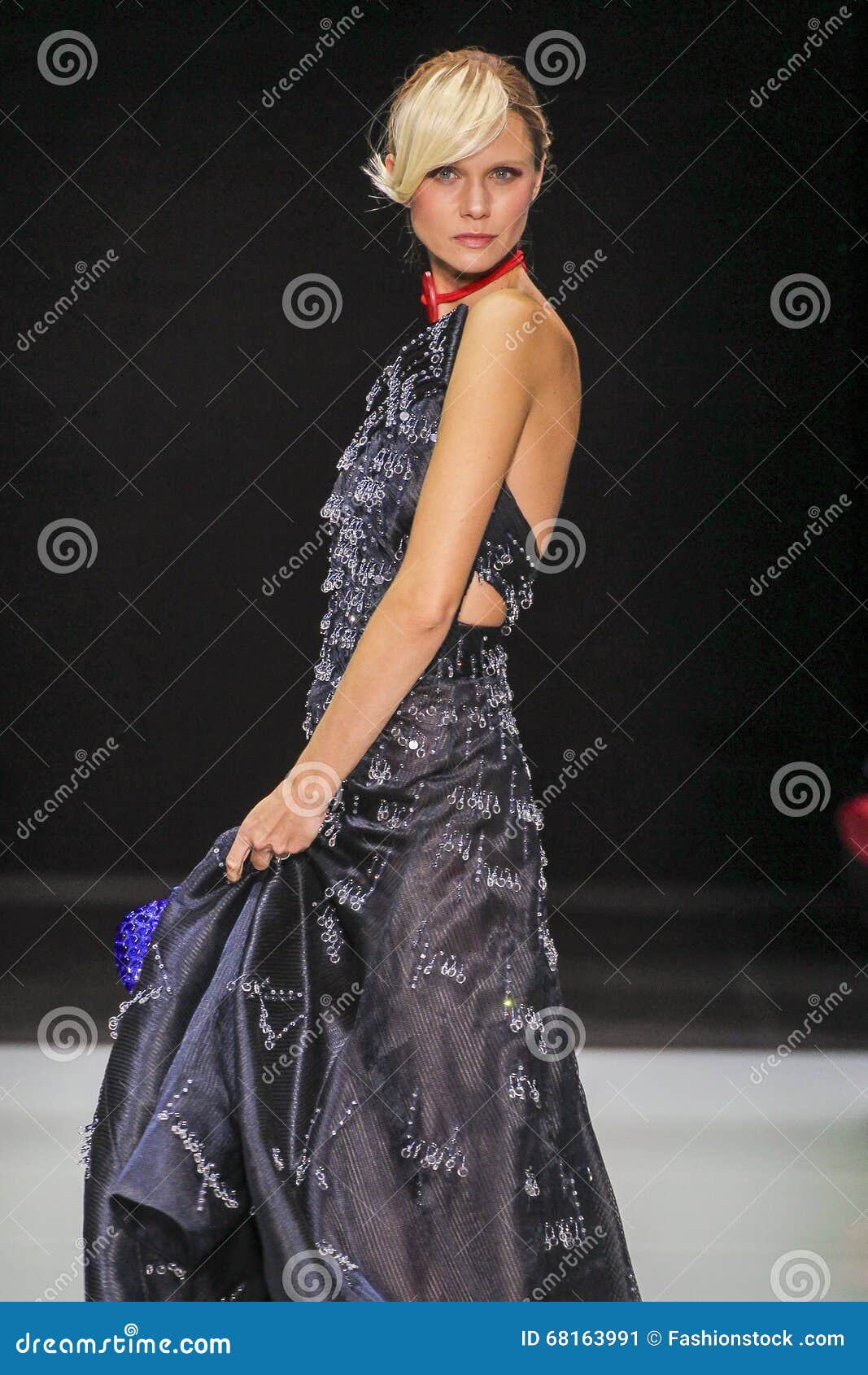 MILAN, ITALY - SEPTEMBER 21, 2019: Woman with green leather Louis Vuitton  bag and white silver dress before Giorgio Armani fashion show, Milan  Fashion Stock Photo - Alamy