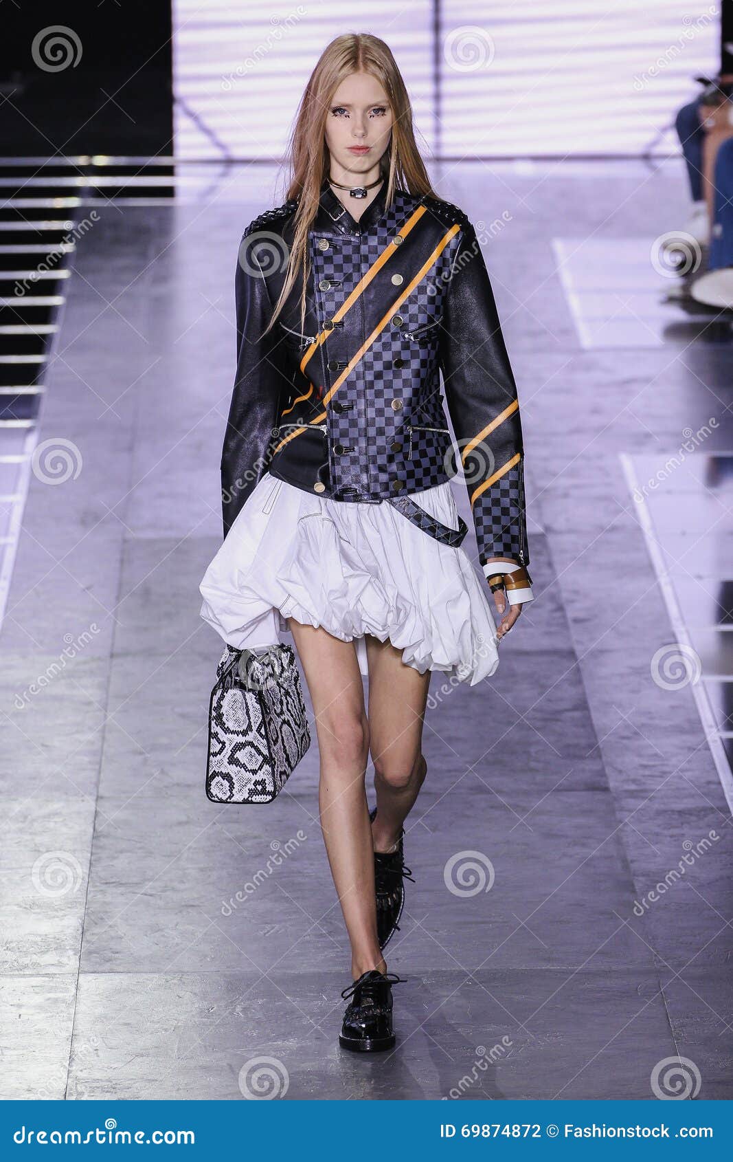 A model walks on the runway at the Louis Vuitton fashion show