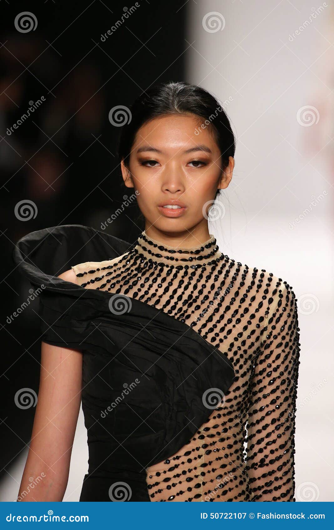 A Model Walks the Runway in a Mimi Tran Design at the Art Hearts ...