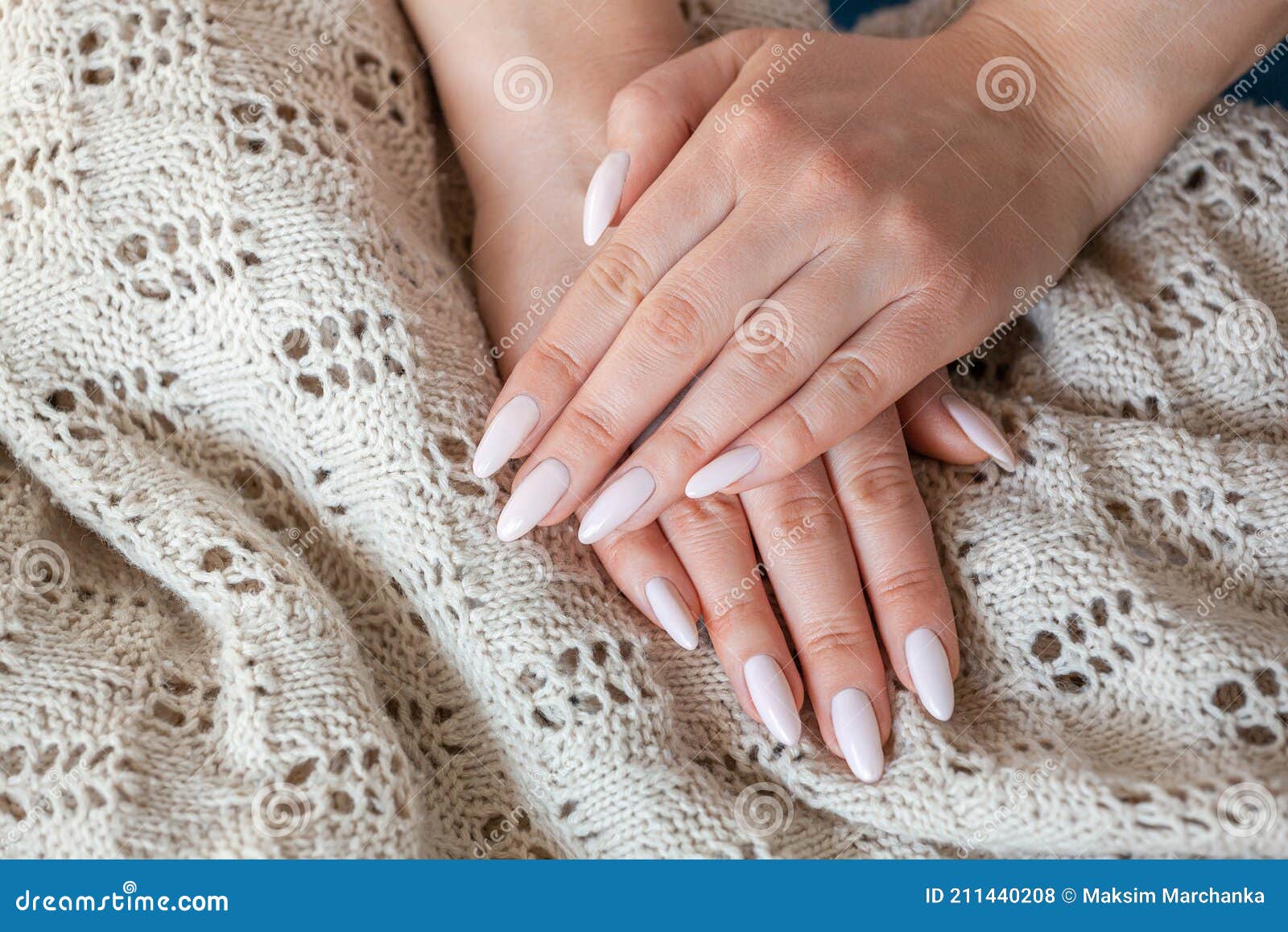 model woman showing .light pale pink nude shellac manicure on lo