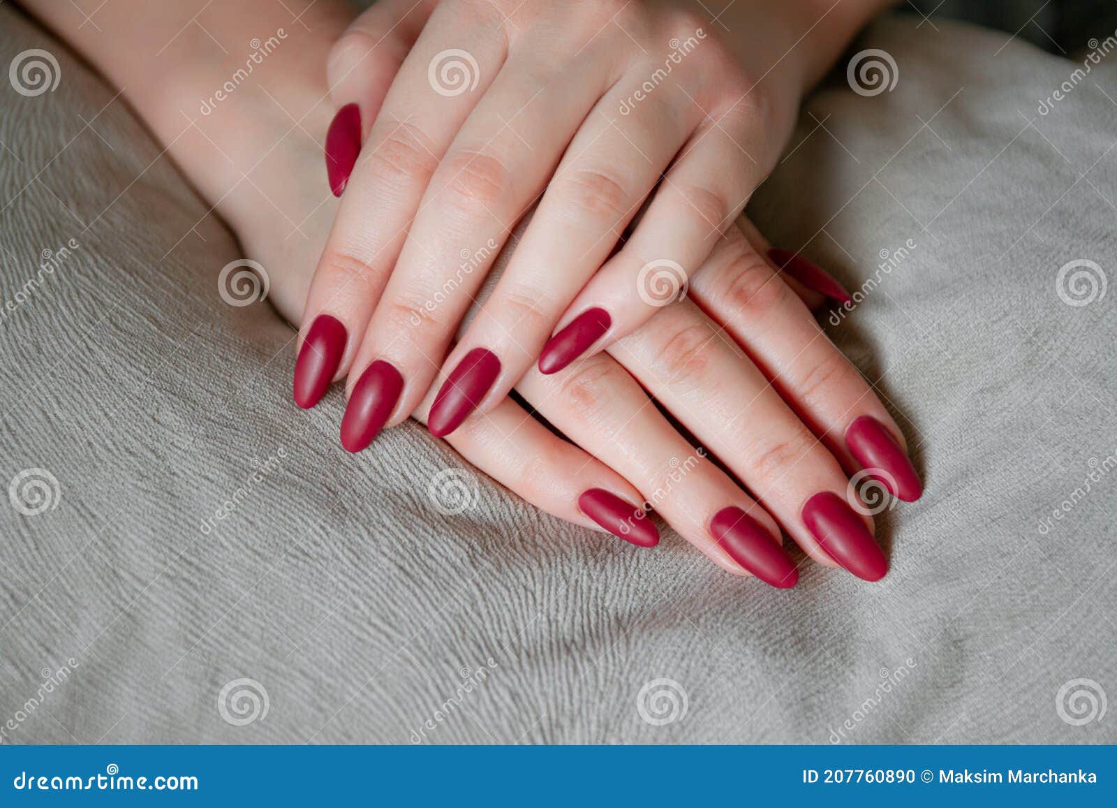 model woman showing red shellac manicure on long nails