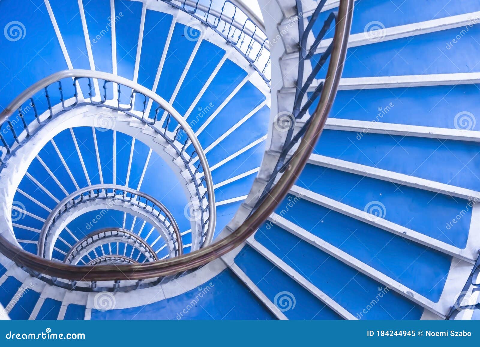 modern abstract spiral staircase, bauhaus style, blue and white staircase