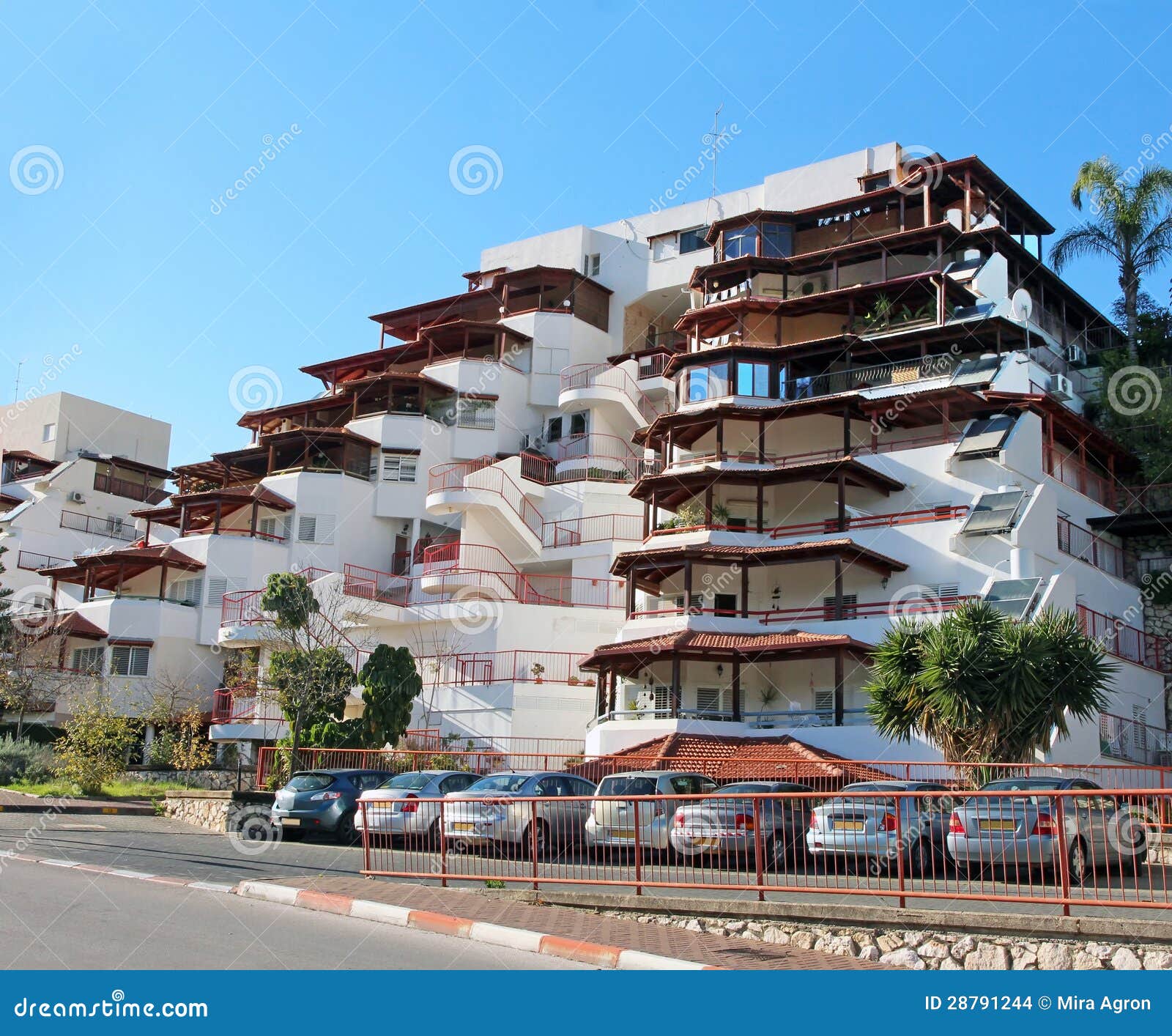 Modern apartment building with balconies in Karmiel, Israel.