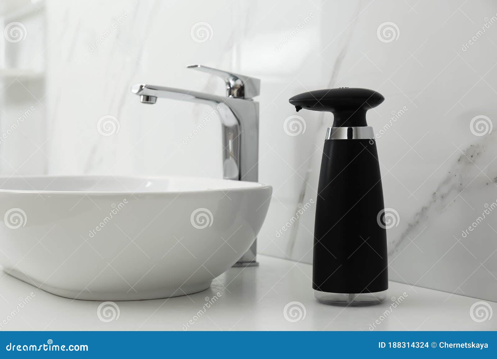 Modern Automatic Soap Dispenser Near Sink in Bathroom Stock Photo
