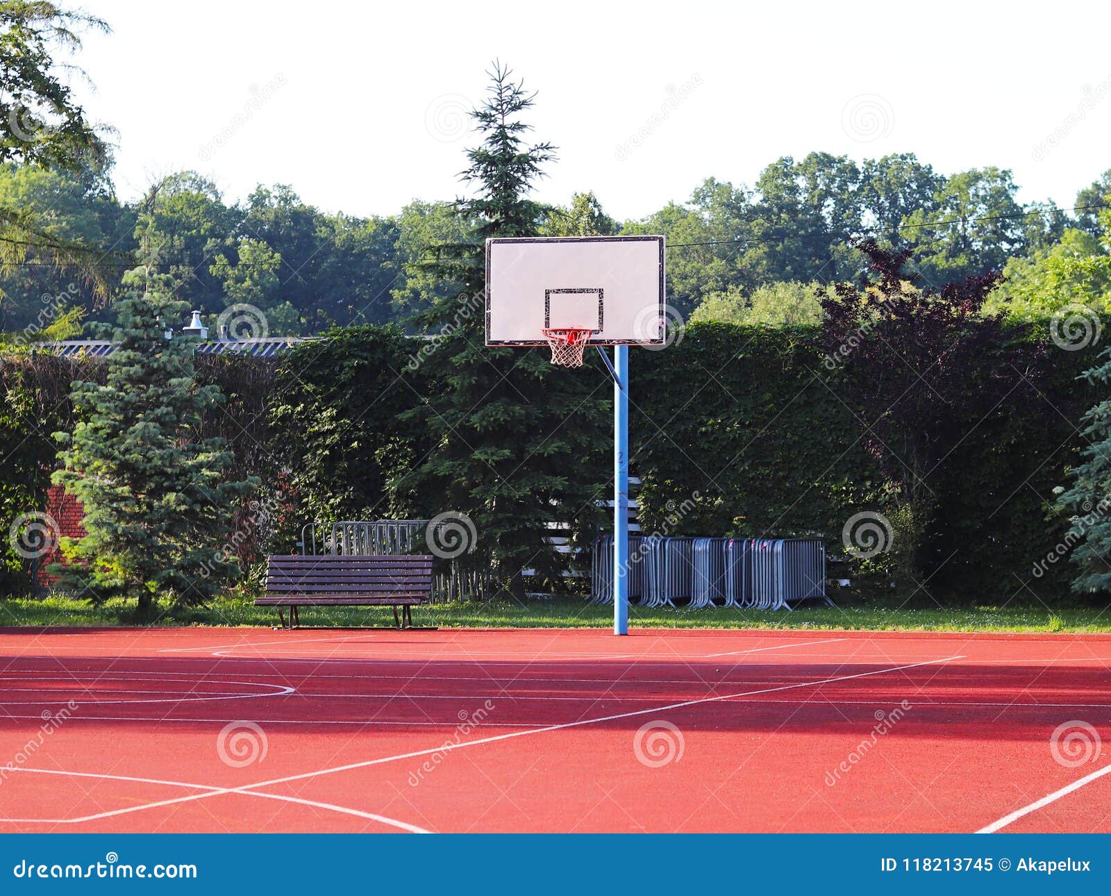 modern basketball court in the courtyard of primary school. multifunctional children`s playground with artificial surfaced fenced