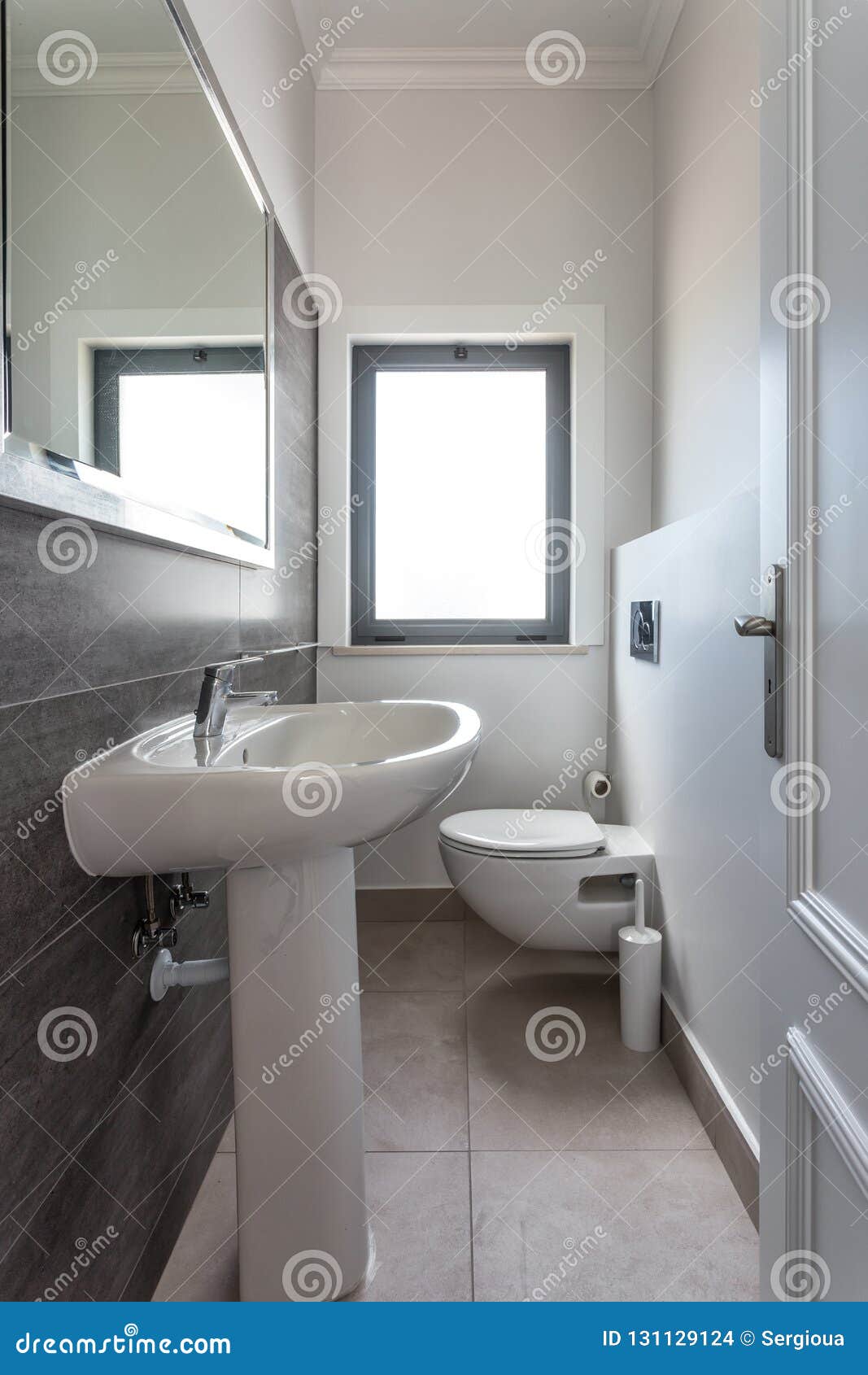 Modern Bathroom Shower Room with Toilet and Amenities. Stock Photo
