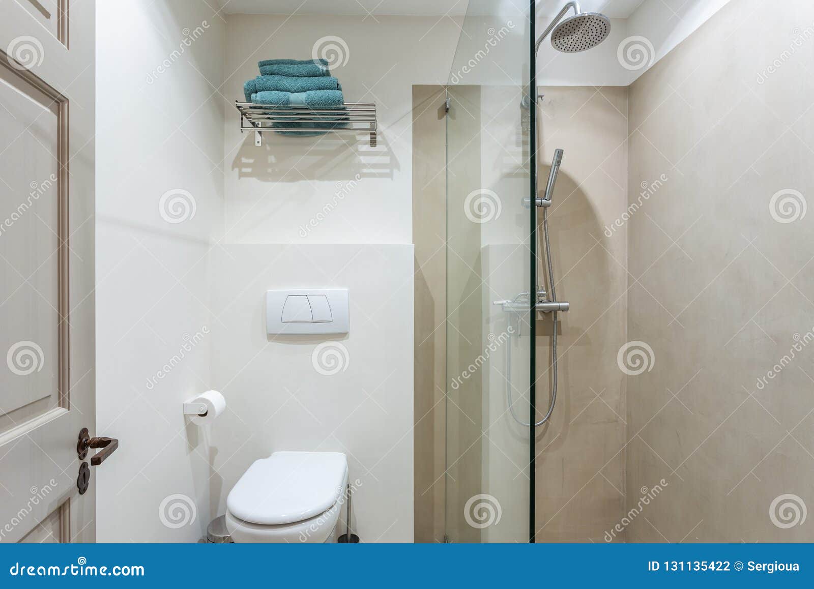 Modern Bathroom Shower Room with Toilet and Amenities. Stock Photo