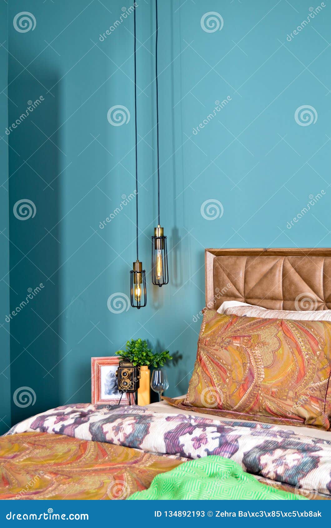 In A Modern Bedroom Bed Pillows And Bedside Lamps Stock Image