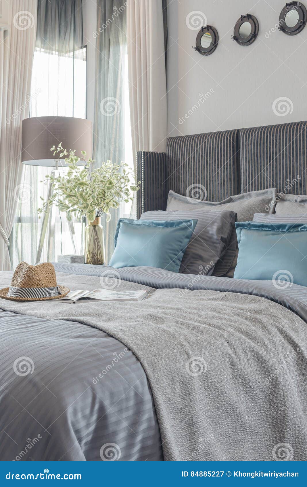 Modern Bedroom with Black Color Bed Tone and Set of Pillows Stock Image