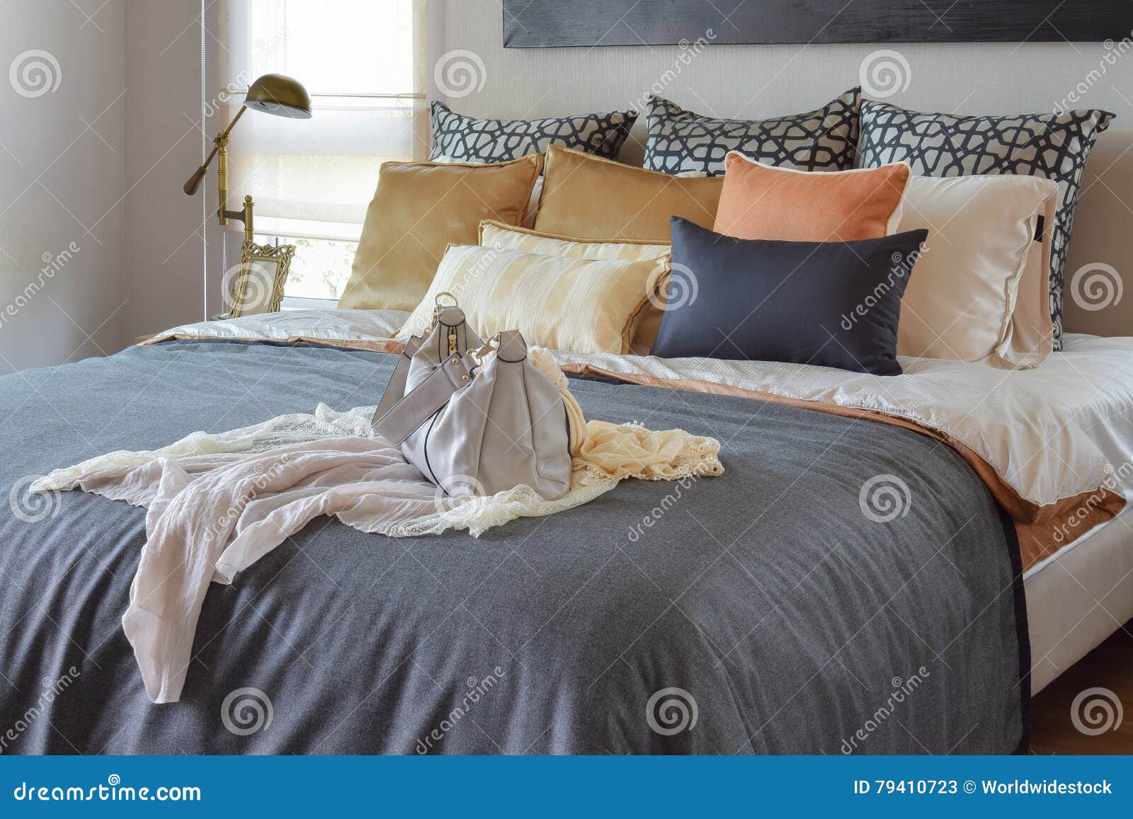 Modern Bedroom Interior with Vintage Handbag on the Bed Stock Image