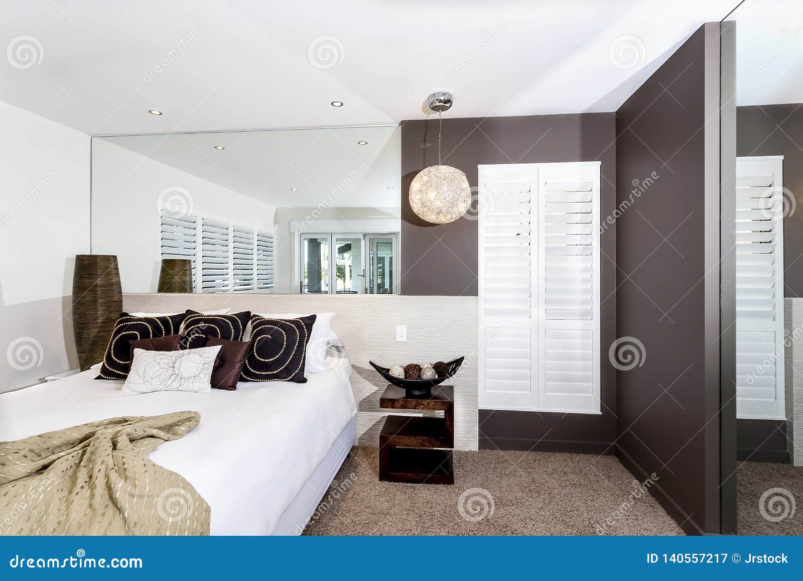 Modern Bedroom With White Sheets And Pillows Stock Image
