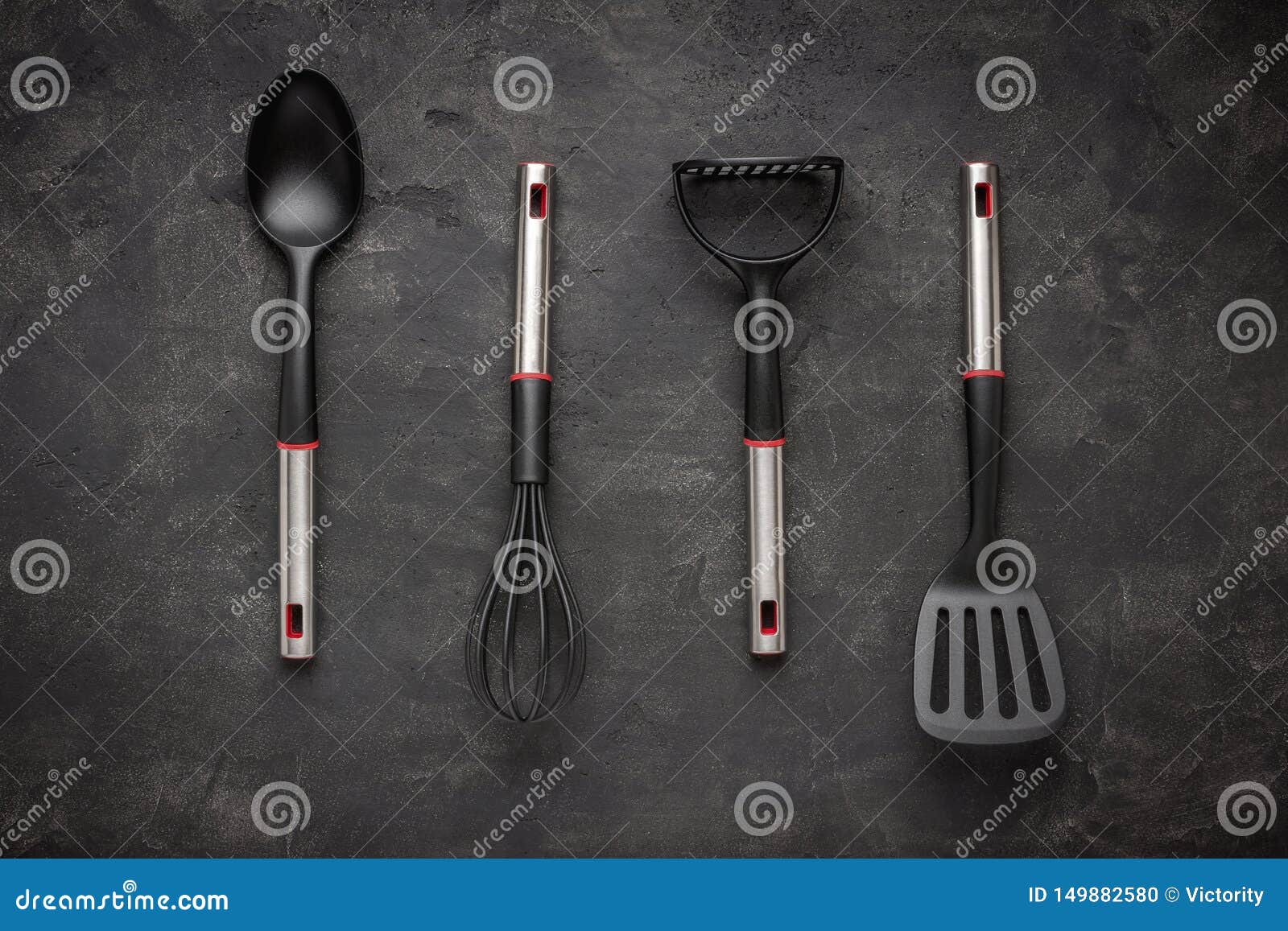 Modern Black Plastic Kitchen Utensils on Dark Background Stock Photo
