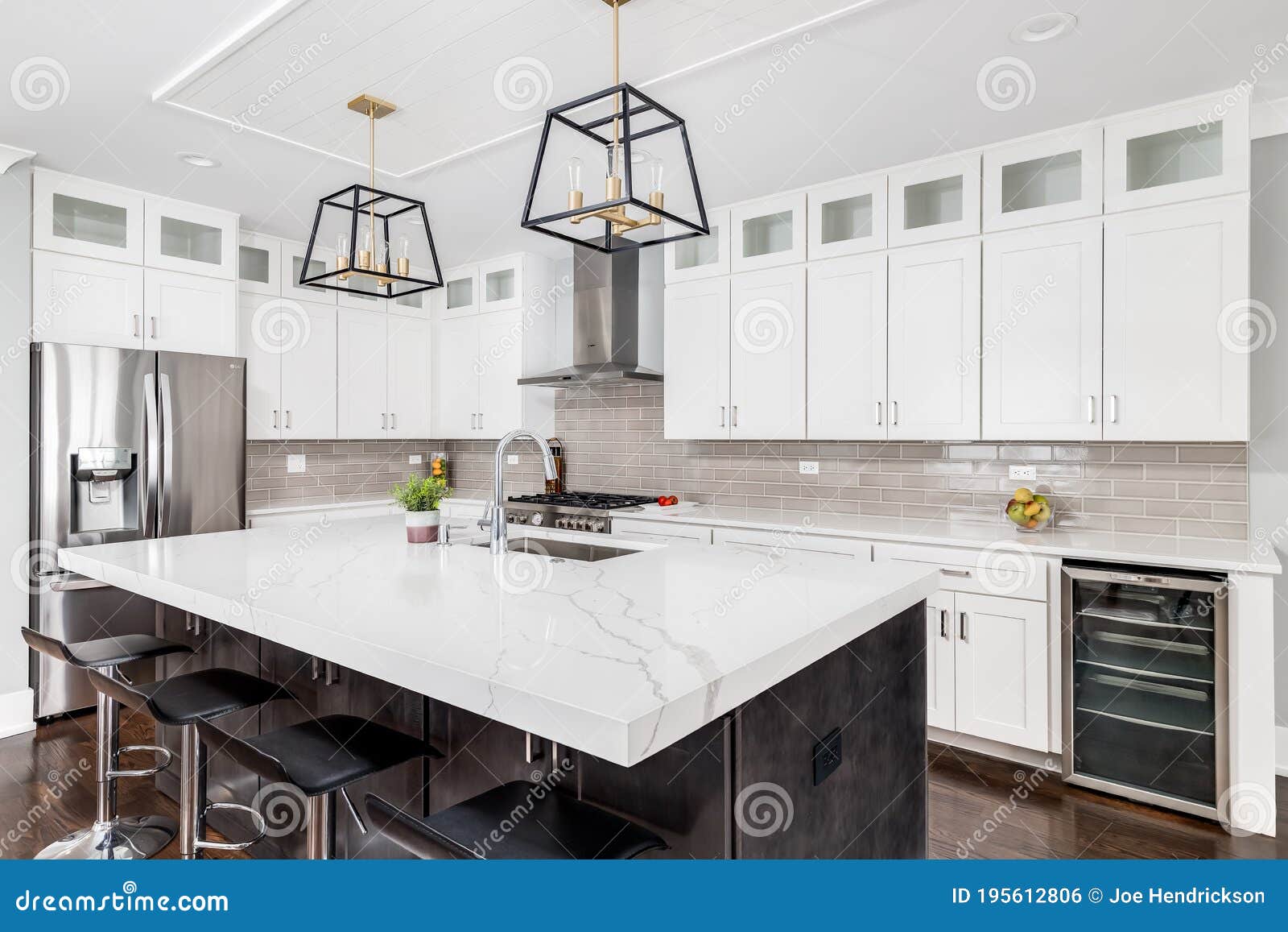 Bertazzoni appliances in a White and gold kitchen with Marble