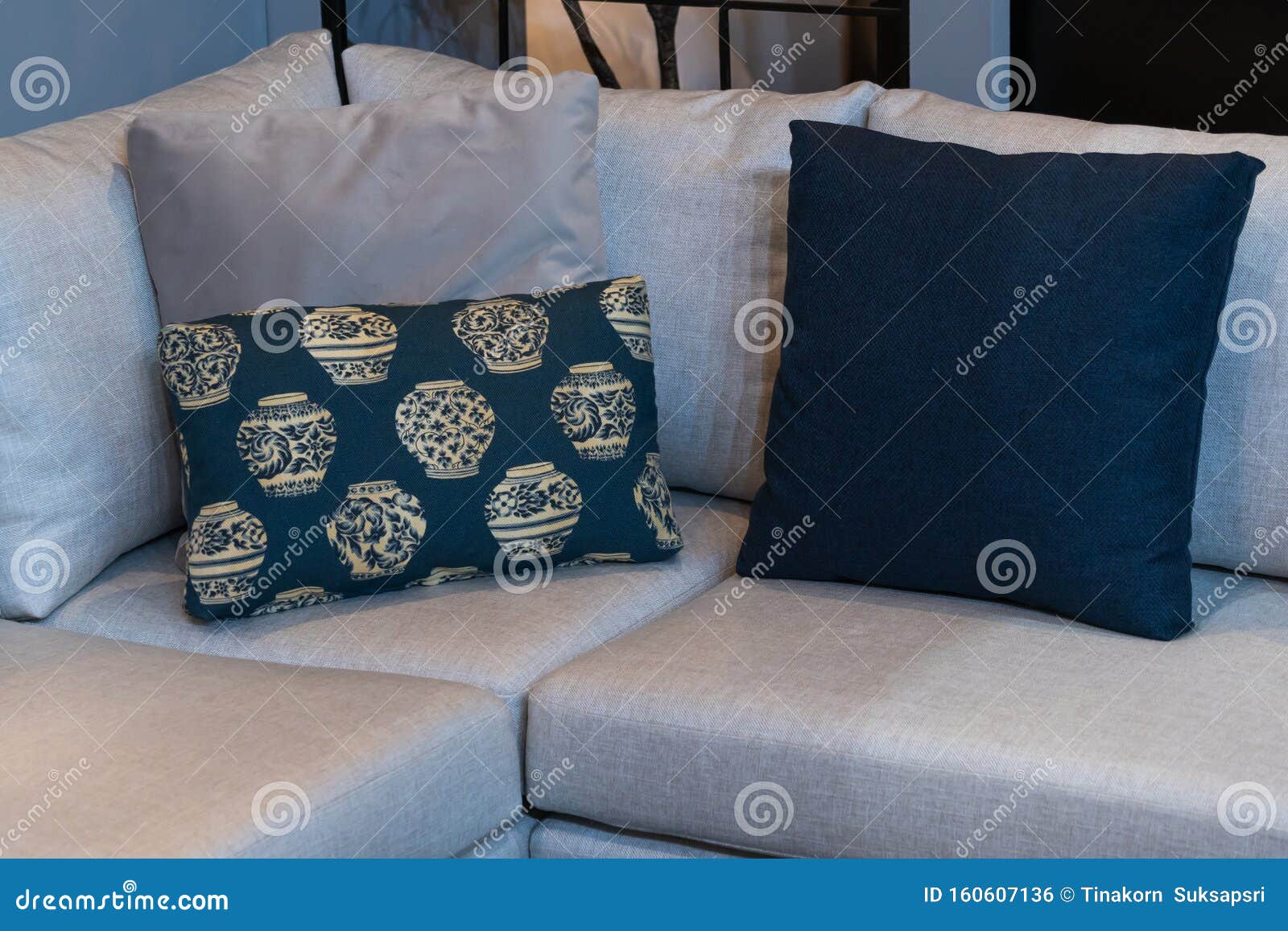 Modern Blue Fabric Pillows and Checkered Pattern on the Cushion Gray