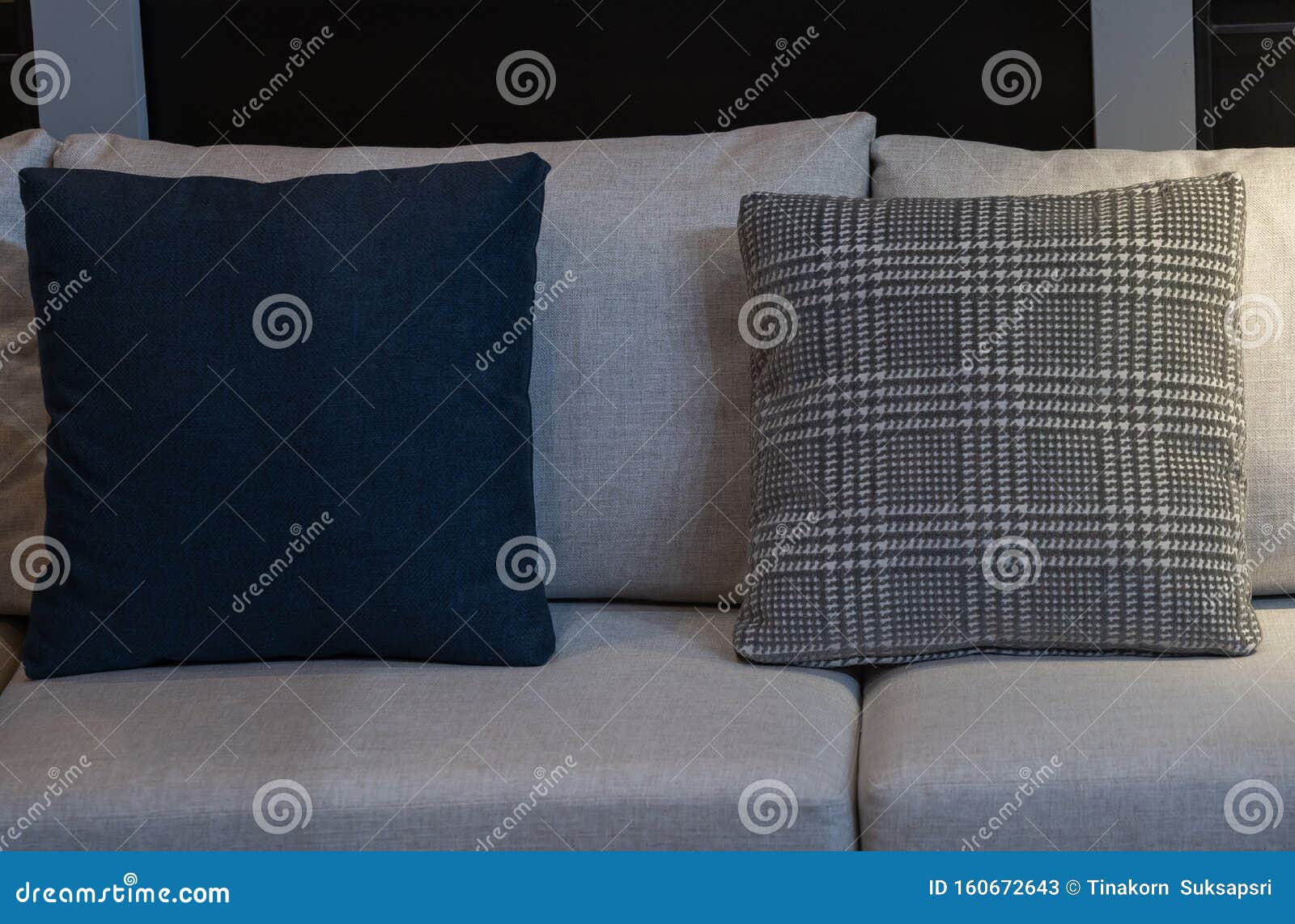 Modern Blue Fabric Pillows and Checkered Pattern on the Cushion Gray