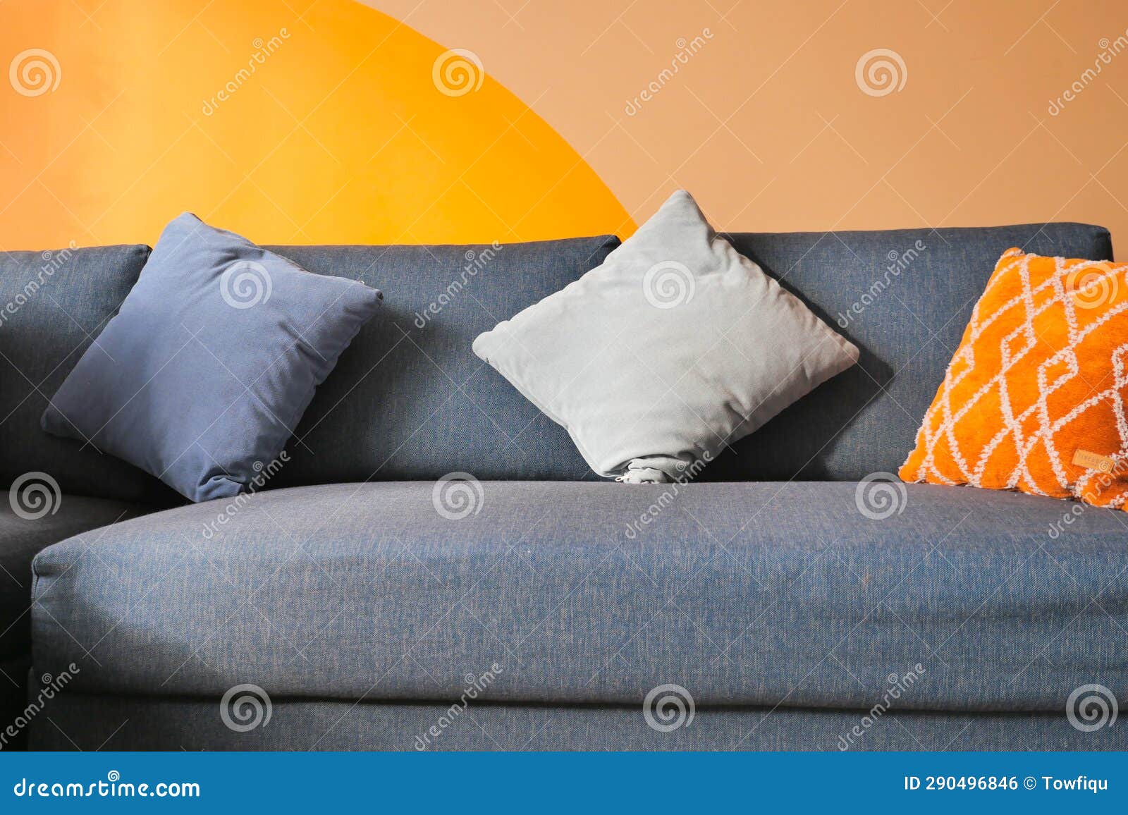 Modern Blue Sofa with Pillows in Living Room at Home Stock Photo