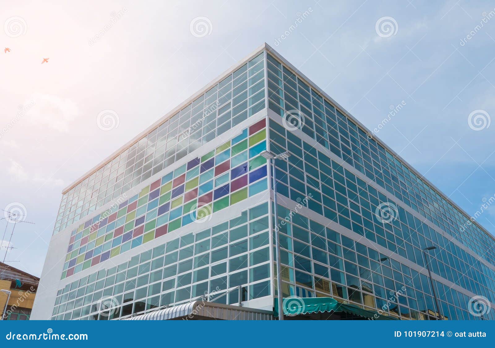 Modern Building and Pattern Colorful Glass and Sky Background Stock