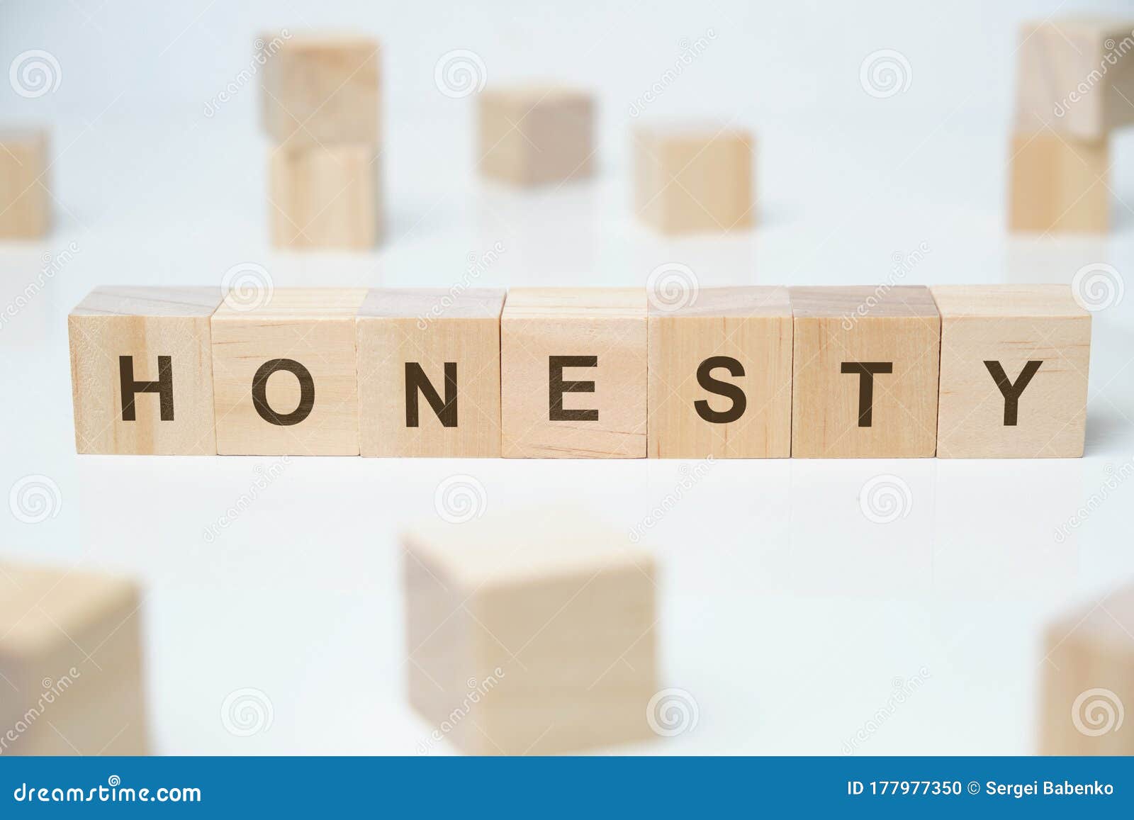 modern business buzzword - honesty. word on wooden blocks on a white background