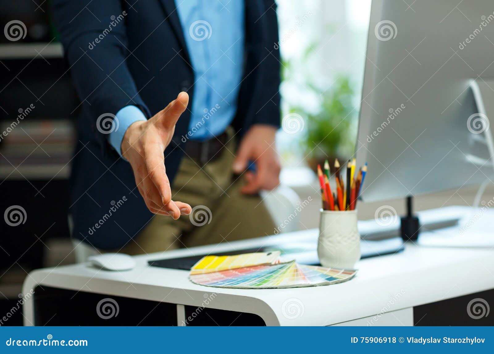 Modern Business Man with Arm Extended To Handshake Stock Photo Image