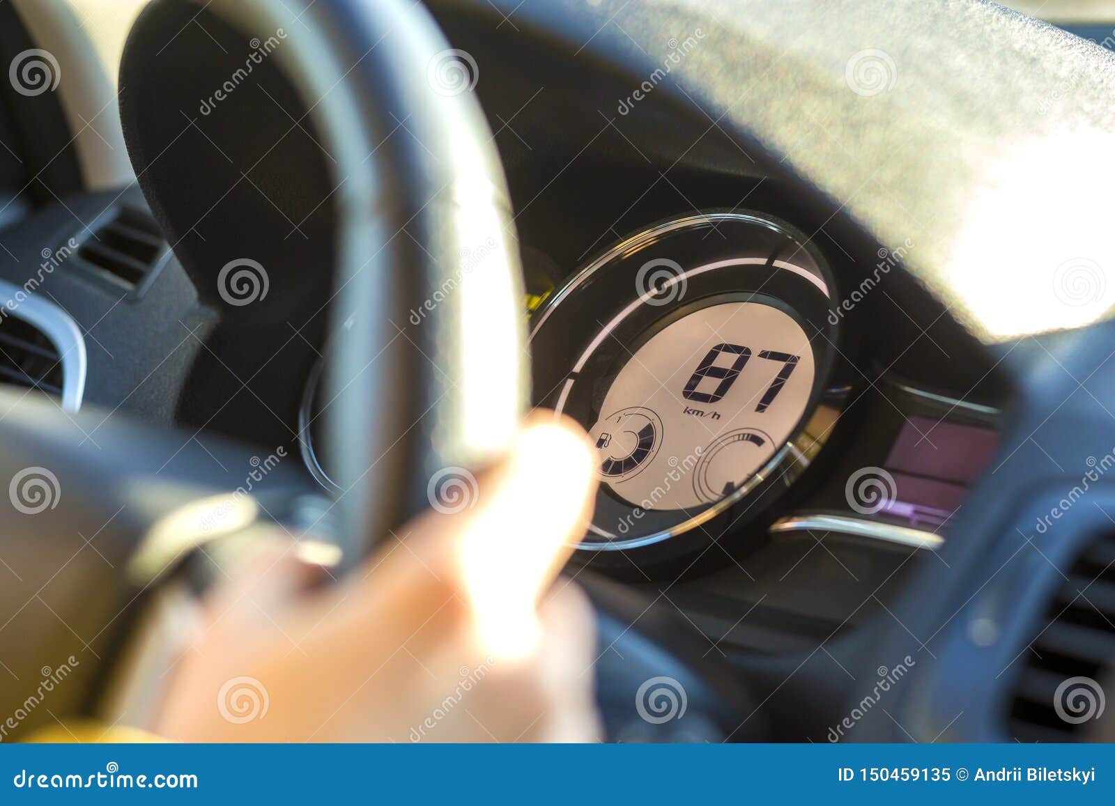Modern Car Interior with Driver Hand on Steering Wheel. Safe Driving